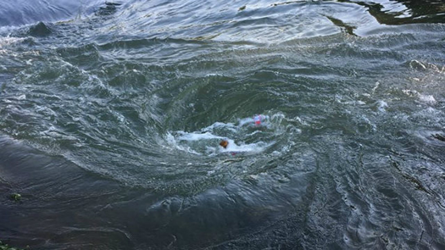 At least one boater died Saturday after a sinkhole opened on the bed of Spring River in northern Arkansas, creating a whirlpool, according to the Arkansas Game and Fish Commission. (Arkansas Game and Fish Commission)