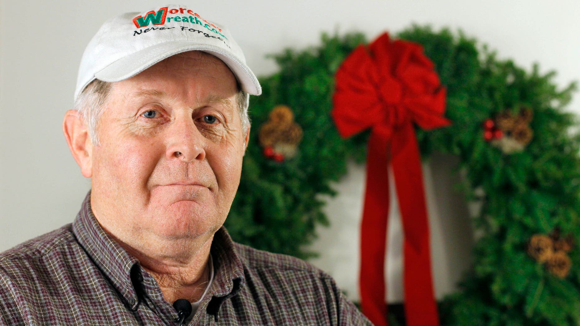 Dec. 2010: Morrill Worcester, president of the Worcester Wreath Co., and founder of the Wreaths Across America mission, poses in Columbia Falls, Maine. Each December for the past 20 years, Worcester's company has placed between 10,000 and 24,000 wreaths on graves at Arlington National Cemetery. This year Worcester has set his sights on placing wreaths on all 220,000 headstones at the cemetery to pay tribute to the nation's veterans.