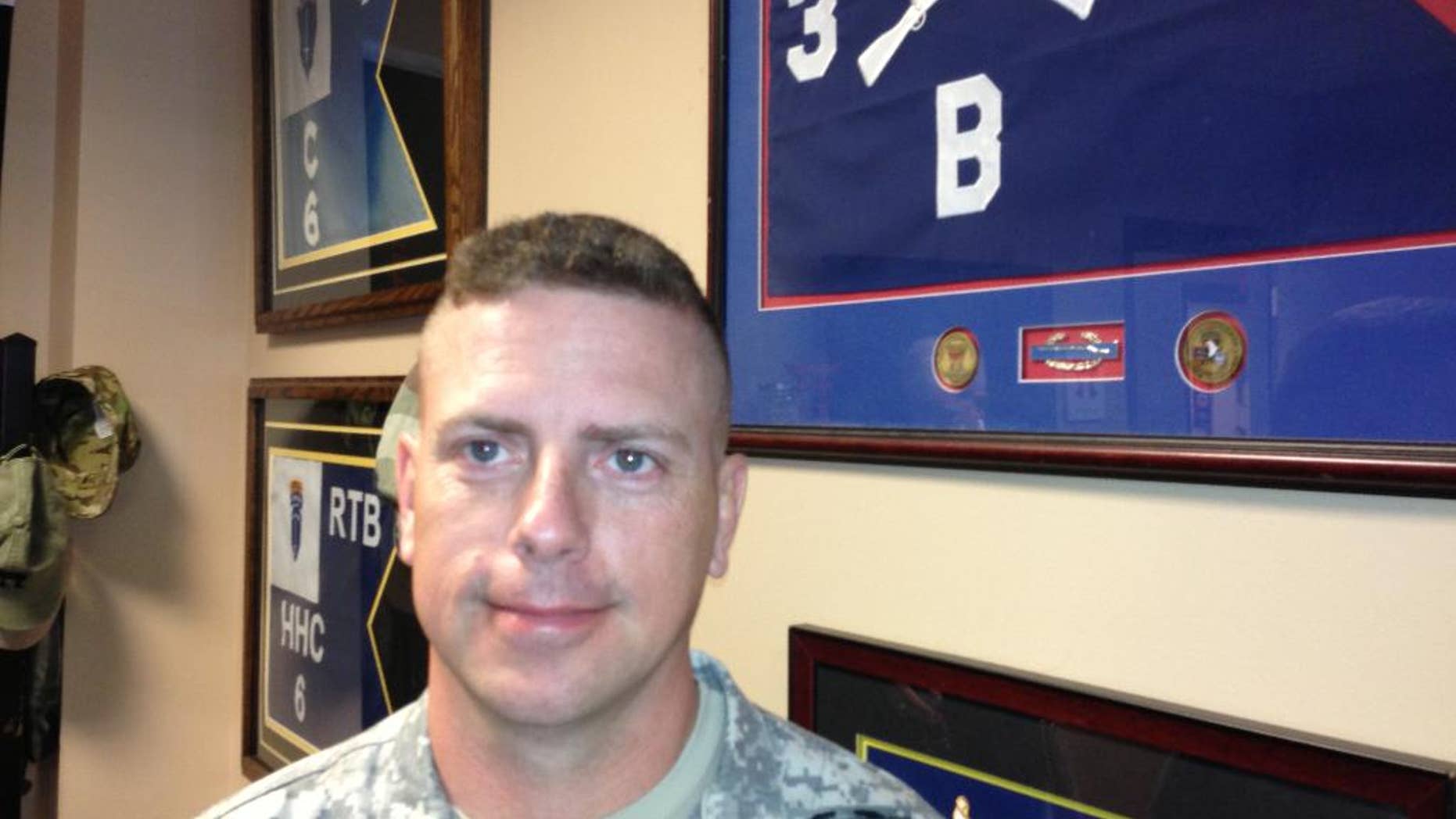 Retired Col. Bob Harkins poses for a photo on May 19, 2014, at Fort Campbell, Ky. Harkins has seen his son follow in his footsteps. Harkins led the "Rakkasans," the 187th Infantry Division, 3rd Brigade Combat Team of the 101st Airborne Division at Fort Campbell into combat at the Battle of Hamburger Hill in May 1969 in Vietnam. Four decades later, his son, Lt. Col. Patrick Harkins led the unit into combat in Afghanistan. (AP Photo/Brett Barrouquere)