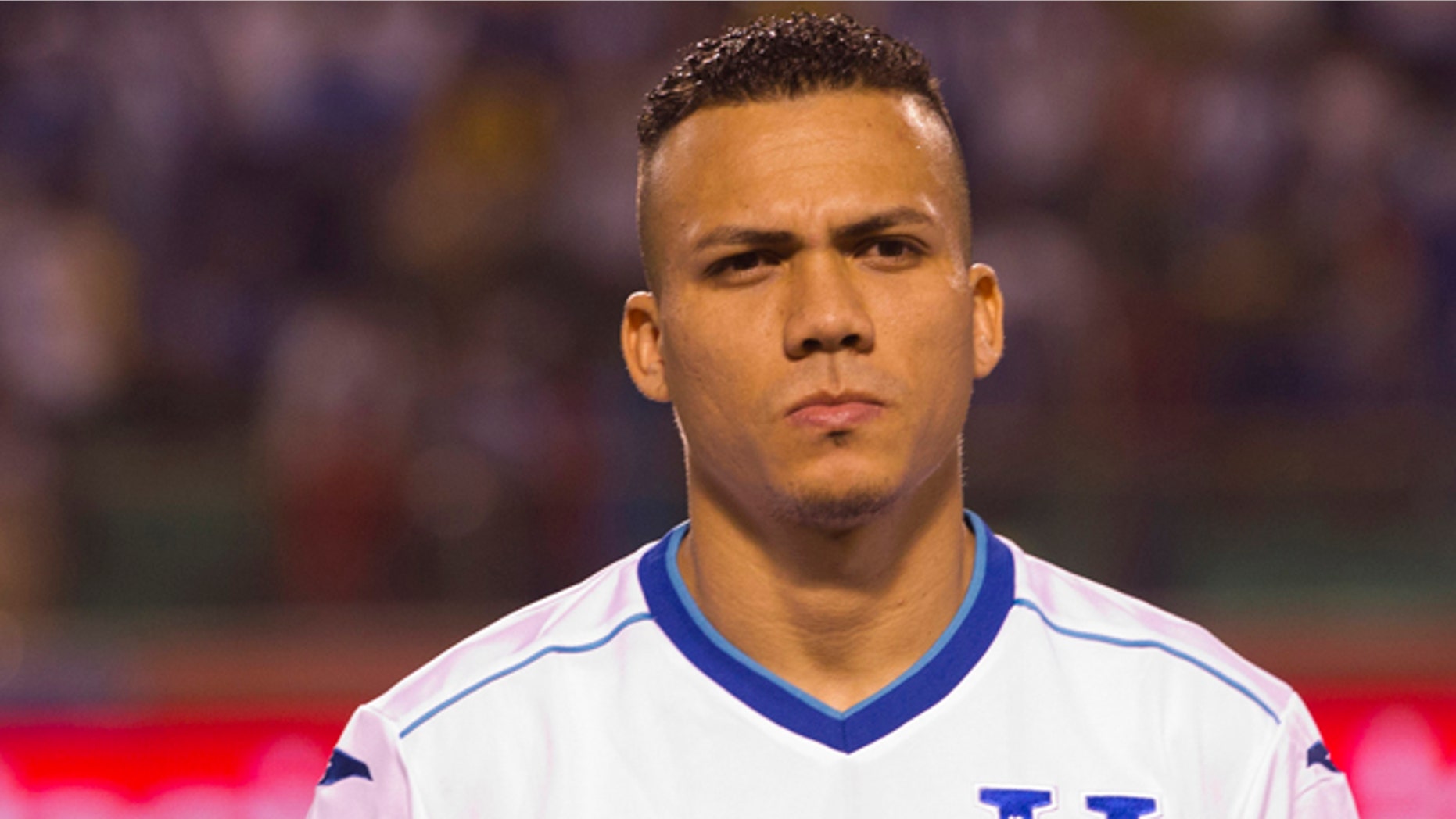 FILE - In this March 5, 2014 file photo, Honduras' soccer player Arnold Peralta prior to a friendly match against Venezuela in San Pedro Sula, Honduras. Peralta's father Carlos confirmed his son was killed on Thursday, Dec. 10, 2015 in his hometown of La Ceiba. Honduran authorities say he was shot dead by an unidentified gunman on a motorcycle in a shopping mall parking lot. (AP Photo/Moises Castillo, File)