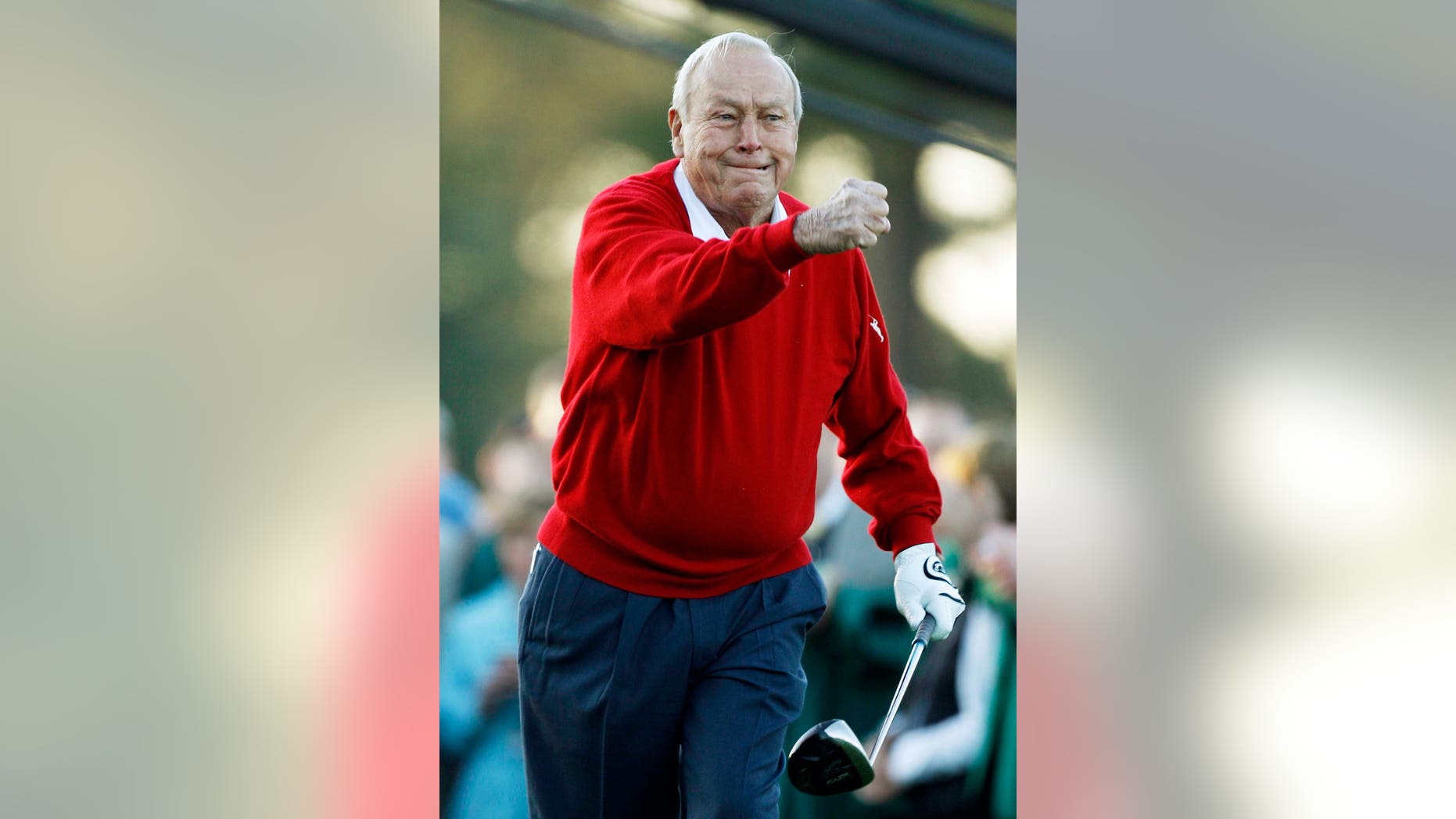 Arnold Palmer celebrates after his ceremonial tee shot before the first round of the Masters golf tournament in Augusta, Ga.