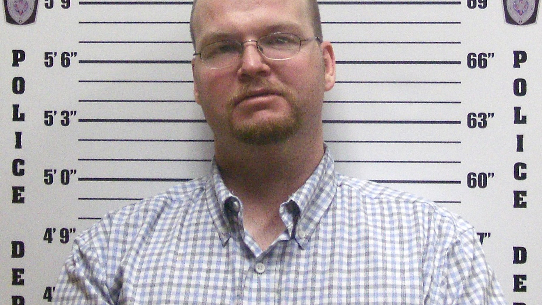 Justin Harrel in booking photo released by Elk City, Ok.