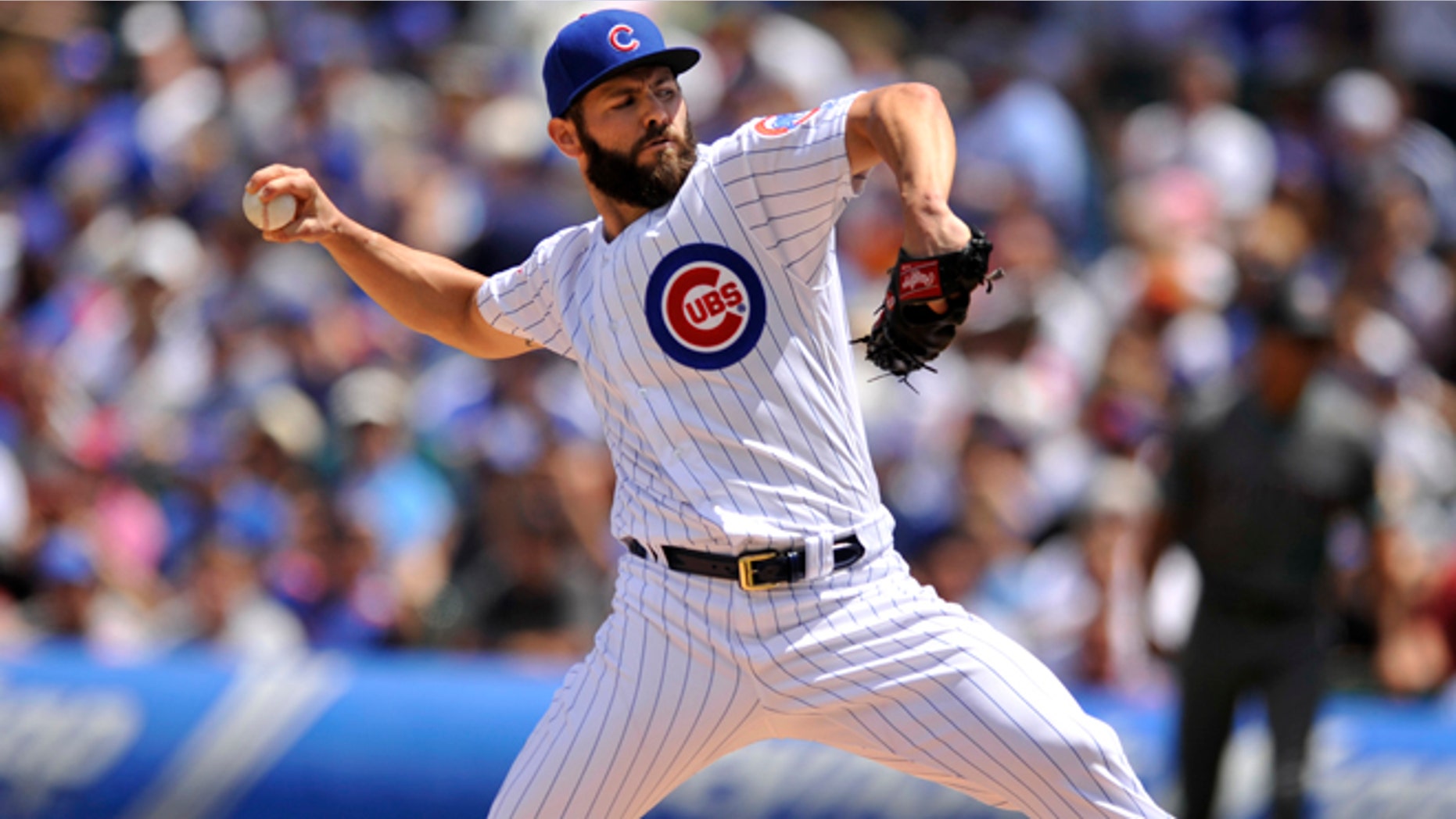 Chicago Cubs starter Jake Arrieta delivers a pitch during the first inning of a baseball game against the Arizona Diamondbacks, Sunday, June 5, 2016, in Chicago. (AP Photo/Paul Beaty)