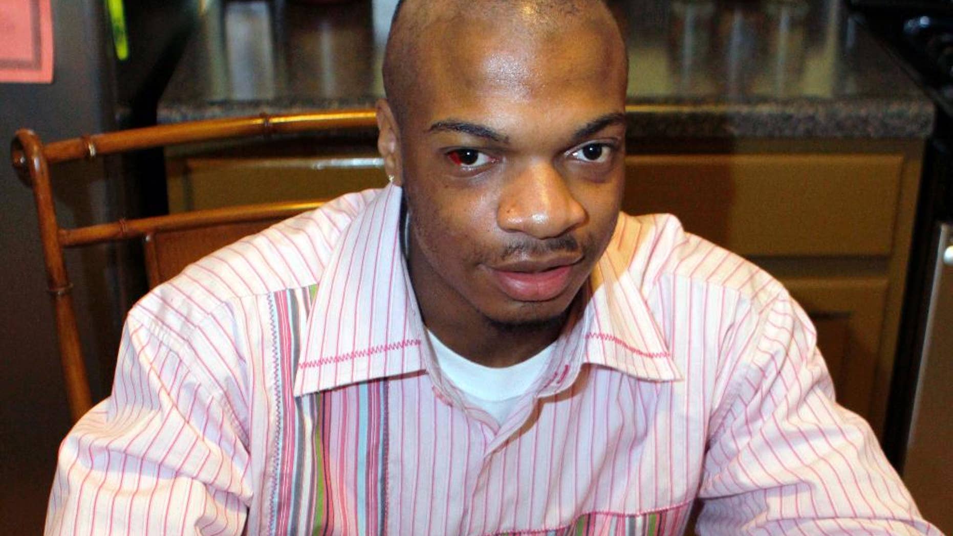 FILE - In this Jan. 22, 2010 file photo, Jordan Miles, then an 18-year-old high school student, talks about his hopes to go to college to study crime scene investigation at his home in Pittsburgh. Three white officers accused in a federal civil rights lawsuit of beating Miles falsely arrested him but didn't use excessive force, a jury found Monday, March 31, 2014, awarding him $119,000 in damages. (AP Photo/Keith Srakocic, File)