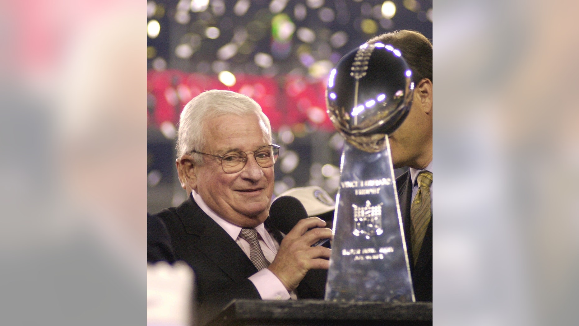 Baltimore Ravens owner Art Modell is seen with the Vince Lombardi Trophy after the Ravens beat the New York Giants 34-7 in Super Bowl XXXV.