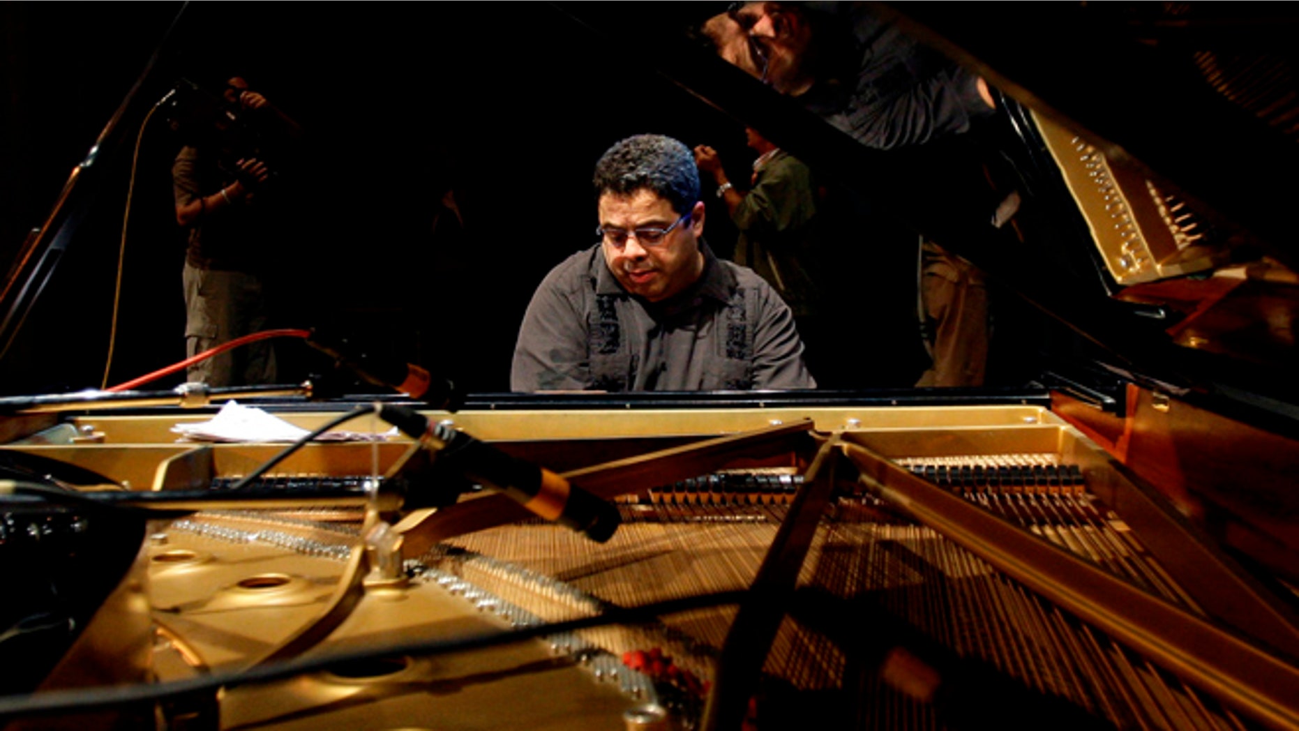 FILE - In this Dec. 15, 2011 file photo, U.S. pianist and composer Arturo O'Farrill rehearses for Cuba's 27th International Jazz Festival in Havana, Cuba. O'Farrill is nominated for two Grammys, one for large jazz ensemble album for "Cuba:The Conversation Continues," and best instrumental composition for "The Afro Latin Jazz Suite." (AP Photo/Franklin Reyes, File)
