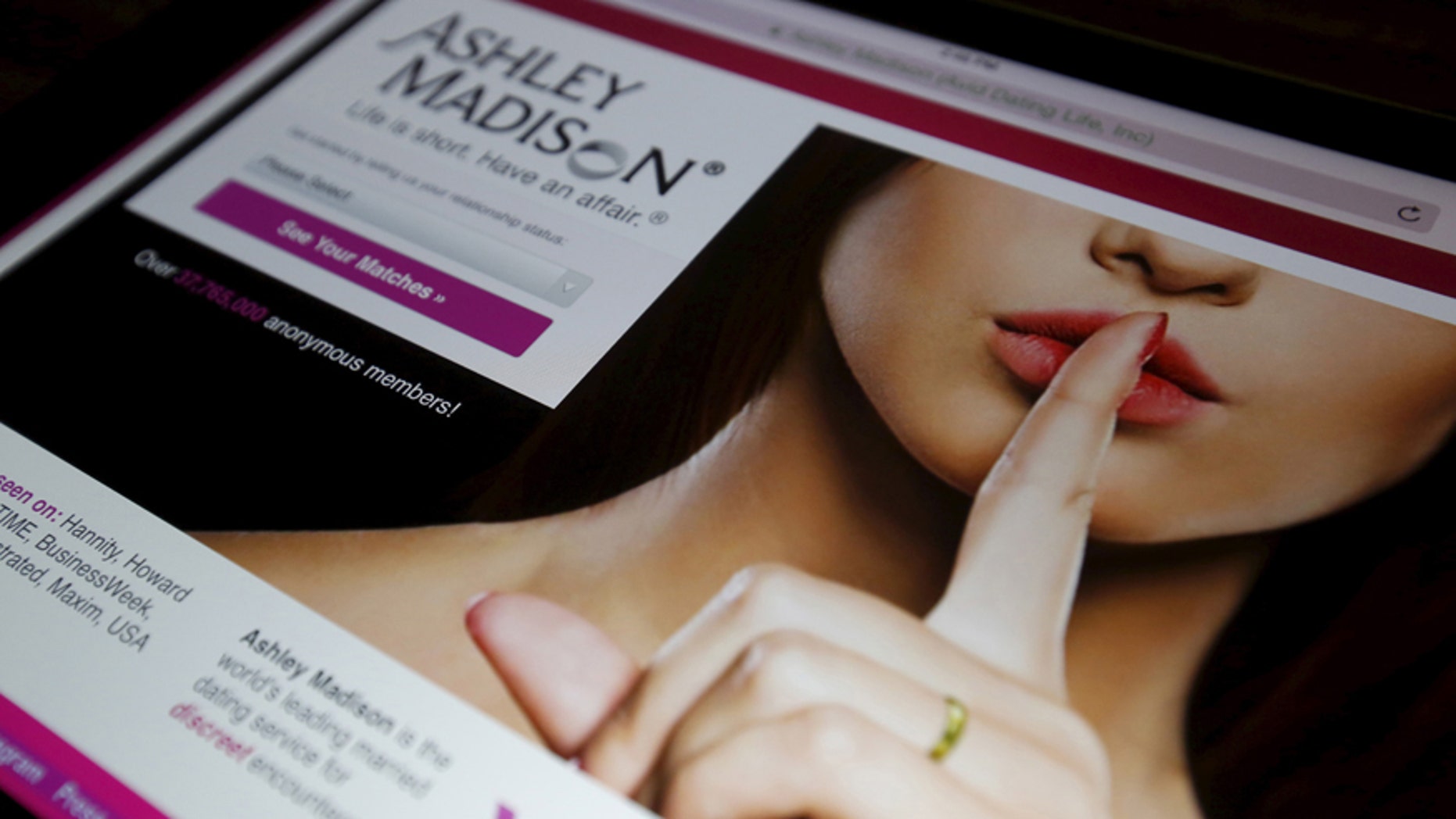 The homepage of the Ashley Madison website is displayed on an iPad, in this photo illustration taken in Ottawa, Canada July 21, 2015.