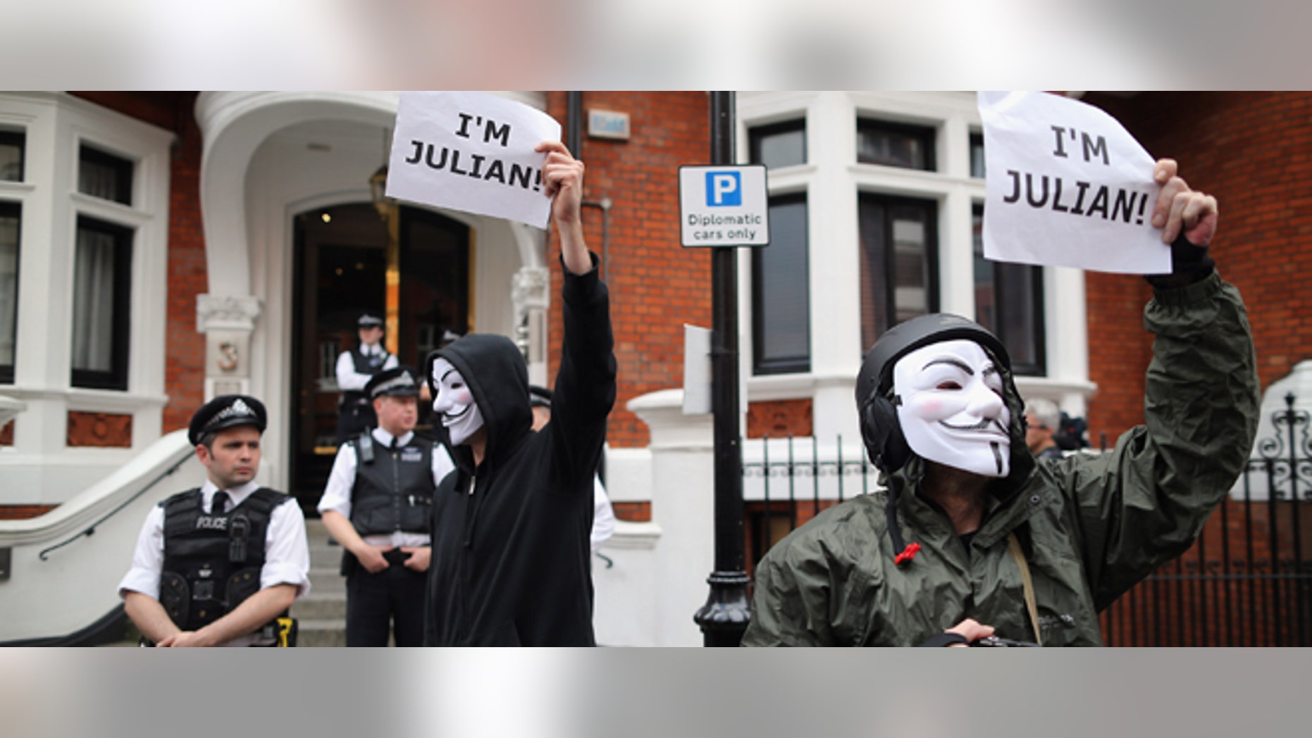 LONDON, ENGLAND - AUGUST 16: Protesters gather outside the Ecuadorian Embassy, where Julian Assange, founder of Wikileaks is staying on August 16, 2012 in London, England. Mr Assange has been living inside Ecuador's London embassy since June 19, 2012 after requesting political asylum whilst facing extradition to Sweden to face allegations of sexual assault. (Photo by Dan Kitwood/Getty Images)