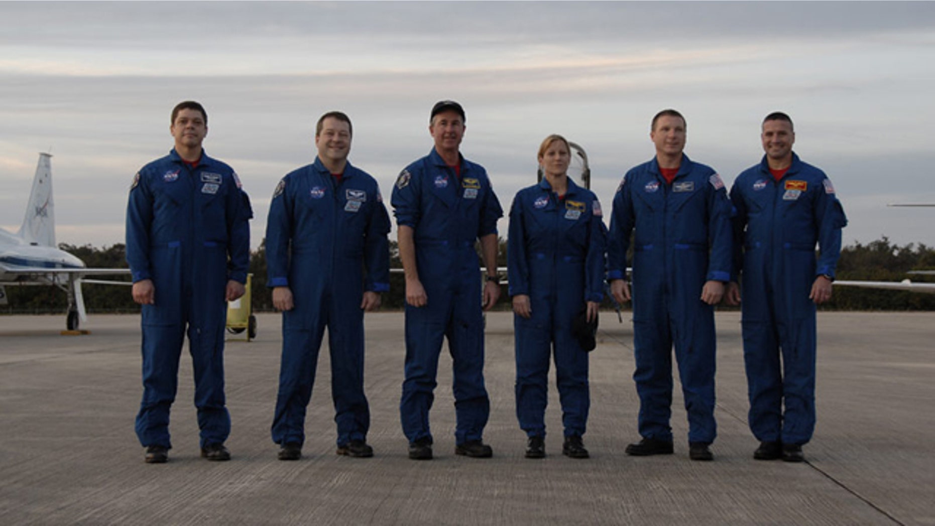The six-astronaut crew of shuttle Endeavour's STS-130 mission pose for a photo at NASA's Shuttle Landing Facility after arriving Jan. 18, 2010 for prelaunch training. Liftoff is set for Feb. 7.
