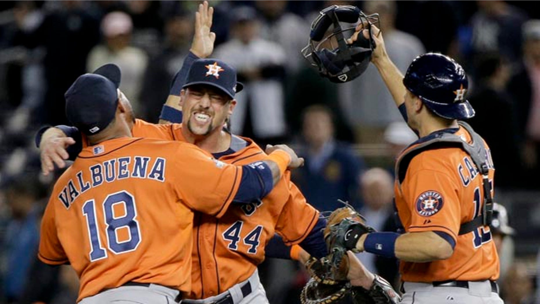Oct. 6, 2015: Houston Astros' Luis Valbuena (18), Luke Gregerson (44) and Jason Castro, right, celebrate after the Astros defeated the New York Yankees 3-0 in the American League wild card baseball game in New York. (AP Photo/Julie Jacobson)