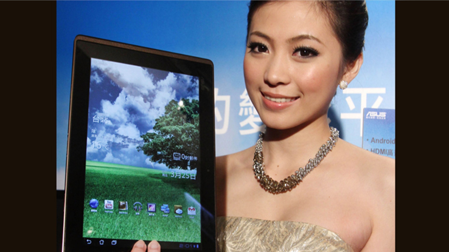 March 25, 2011: A Taiwanese model displays an Asus Eee Pad Transformer during its new product media event in Taipei, Taiwan. The Asus Eee Pad Transformer features a 10.1-inch touch screen, tablet with a detachable keyboard dock.