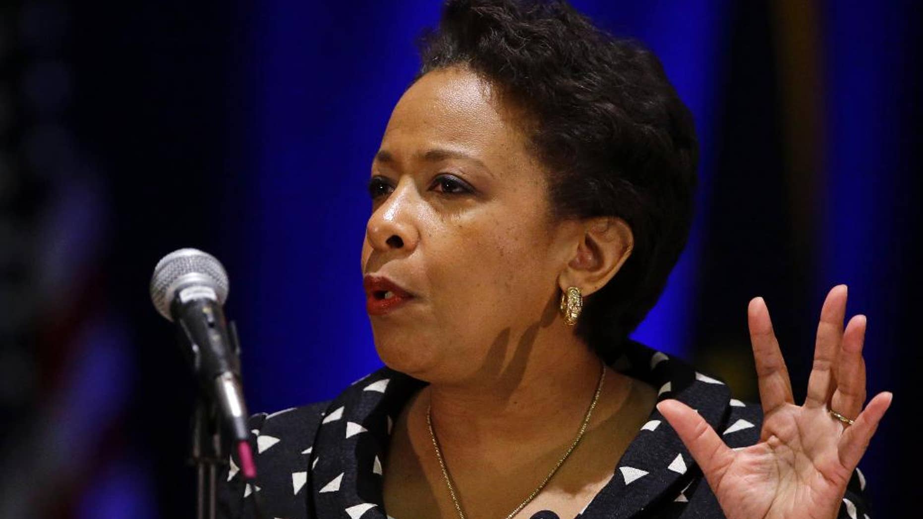 FILE - In this Monday, July 13, 2015, file photo, U.S. Attorney General Loretta E. Lynch delivers the keynote address at the National Organization of Black Law Enforcement Executives training conference in Indianapolis. Lynch is bringing her national community policing tour to Connecticut, where she will highlight changes East Haven police have made over the last several years to strengthen ties with local residents. (AP Photo/Michael Conroy, File)