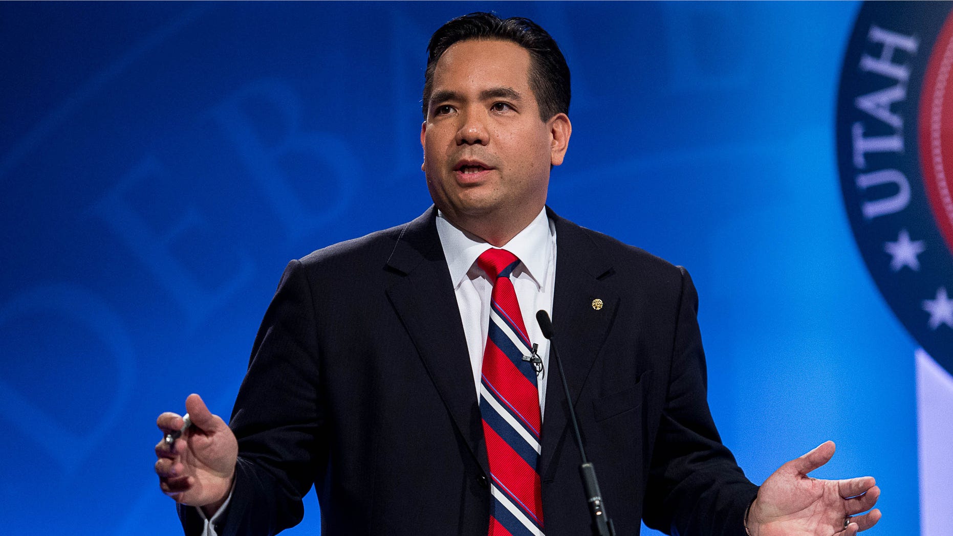 FILE - In this Oct. 1, 2014 file photo, Sean Reyes speaks during his debate with Charles Stormont as the Utah Attorney General hopefuls debate at KBYU Studios in Provo, Utah. Reyes says he secretly traveled to South America to play a role in a sex-trafficking sting operation in order to help fight the crime before victims end up in Utah. Reyes spoke this week about the trip to Colombia in October, where he pretended to be a bodyguard and Spanish-speaking translator for businessmen seeking children for a sex party. (AP Photo/The Salt Lake Tribune, Trent Nelson, Pool)