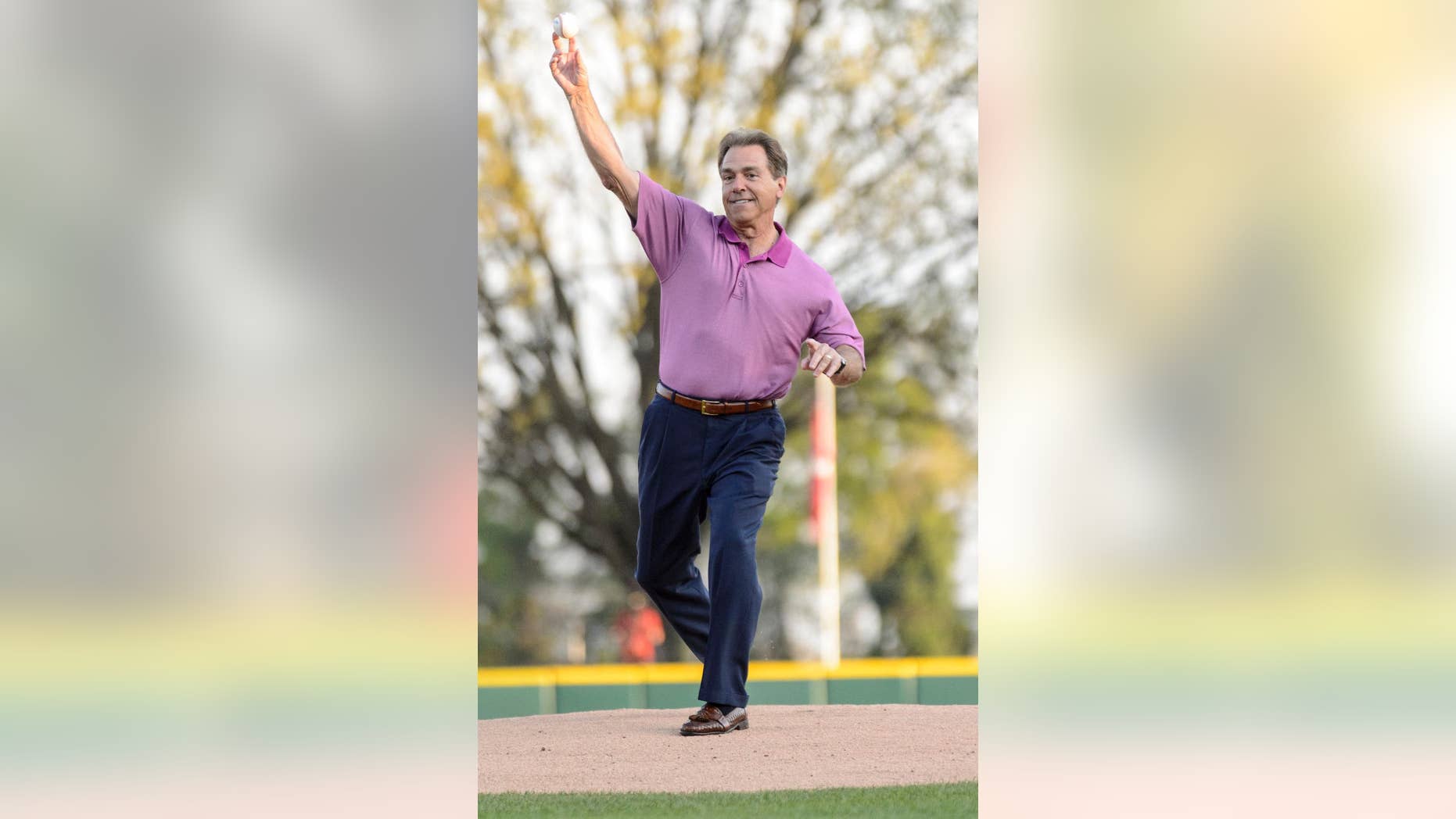 Alabama football coach Nick Saban throws out the ceremonial first pitch at an NCAA college baseball game between Alabama and Auburn, Friday, April 11, 2014, at Sewell-Thomas Stadium in Tuscaloosa, Ala. (AP Photo/Alabama Media Group, Vasha Hunt) MAGAZINES OUT