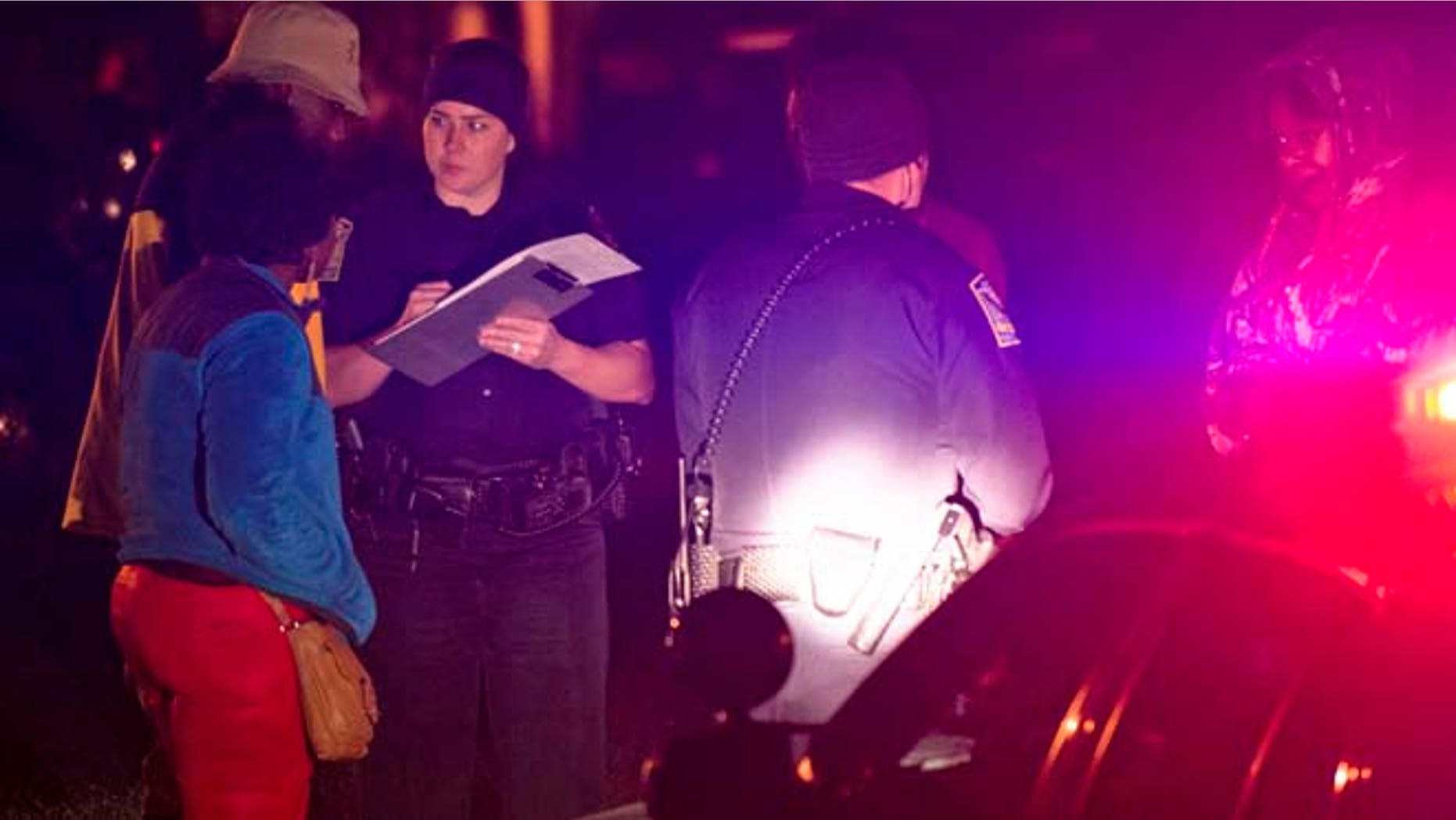 Dec. 14, 2014: Auburn Police investigate a shooting at the Tiger Lodge apartments in Auburn, Ala. (AP/Montgomery Advertiser/Albert Cesare)