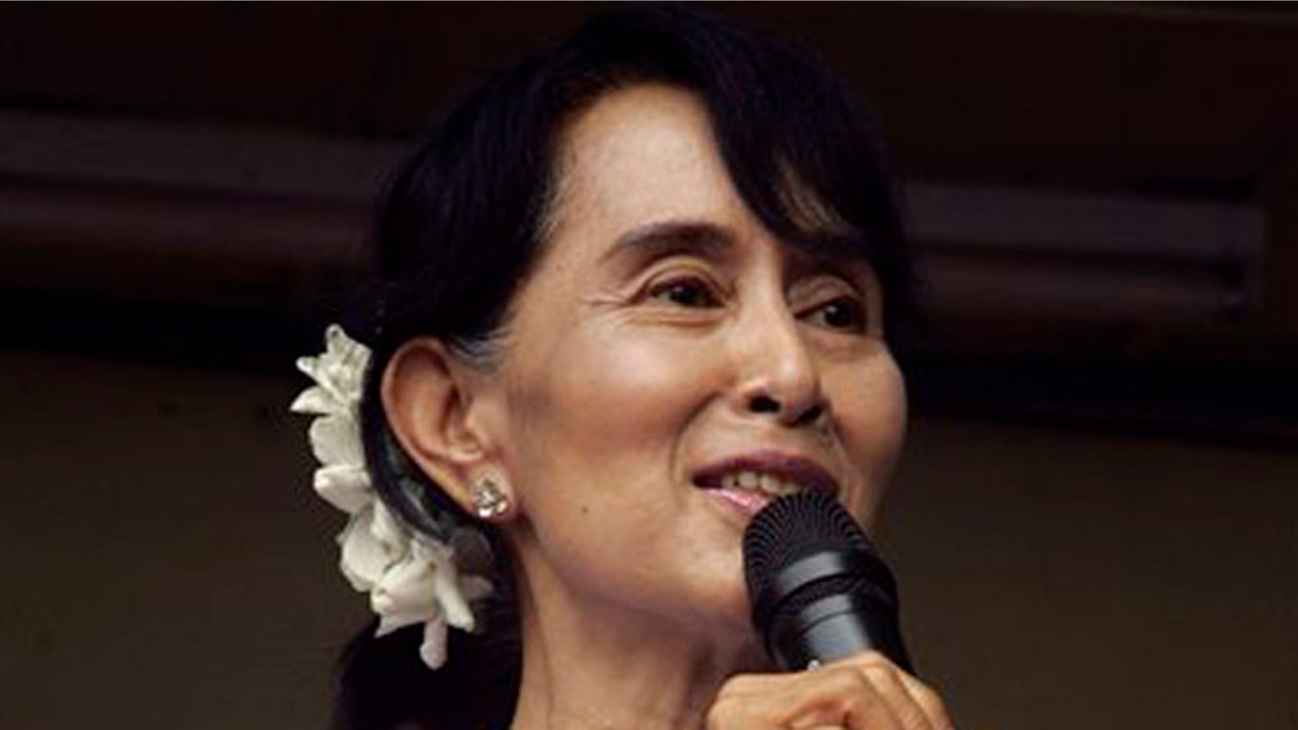 April 2, 2012: Myanmar pro-democracy leader Aung San Suu Kyi talks to supporters at the headquarters of her National League for Democracy party in Yangon, Myanmar.