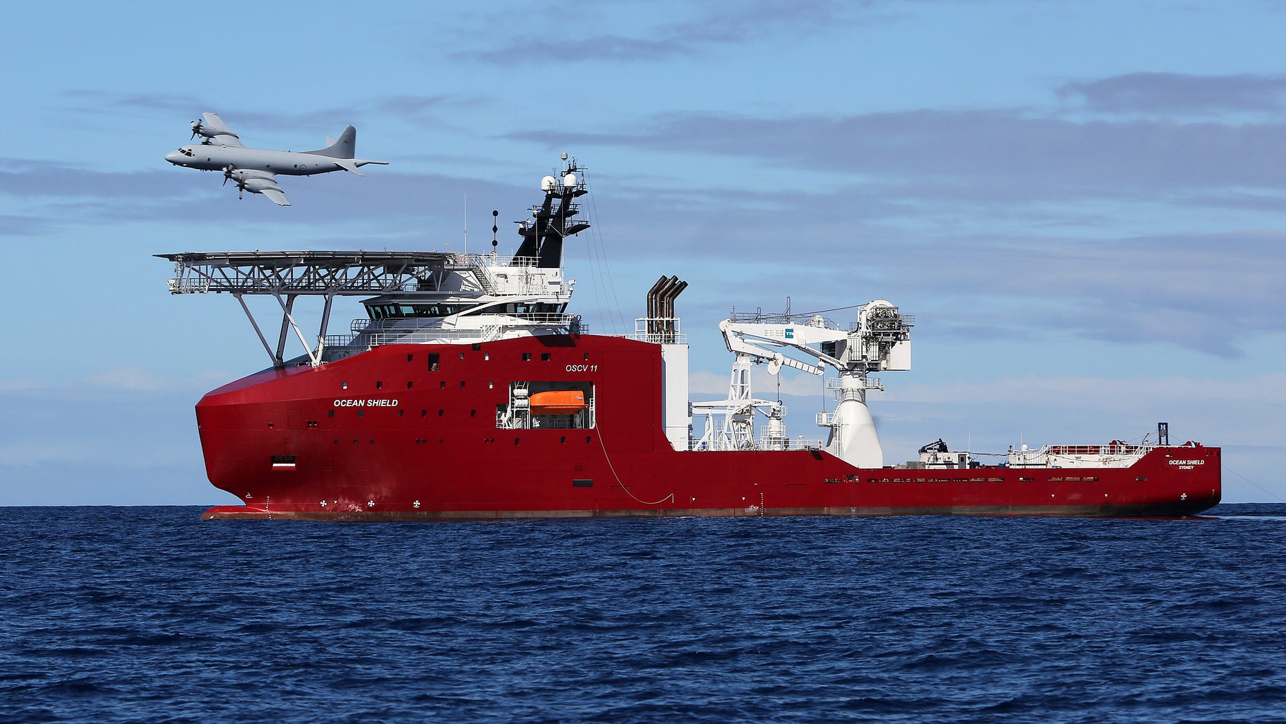 April 9, 2014 - Royal Australian Air Force AP-3C Orion flies past Australian Defense vessel Ocean Shield on a mission to drop sonar buoys to assist in the acoustic search of the missing Malaysia Airlines Flight 370 in the southern Indian Ocean.