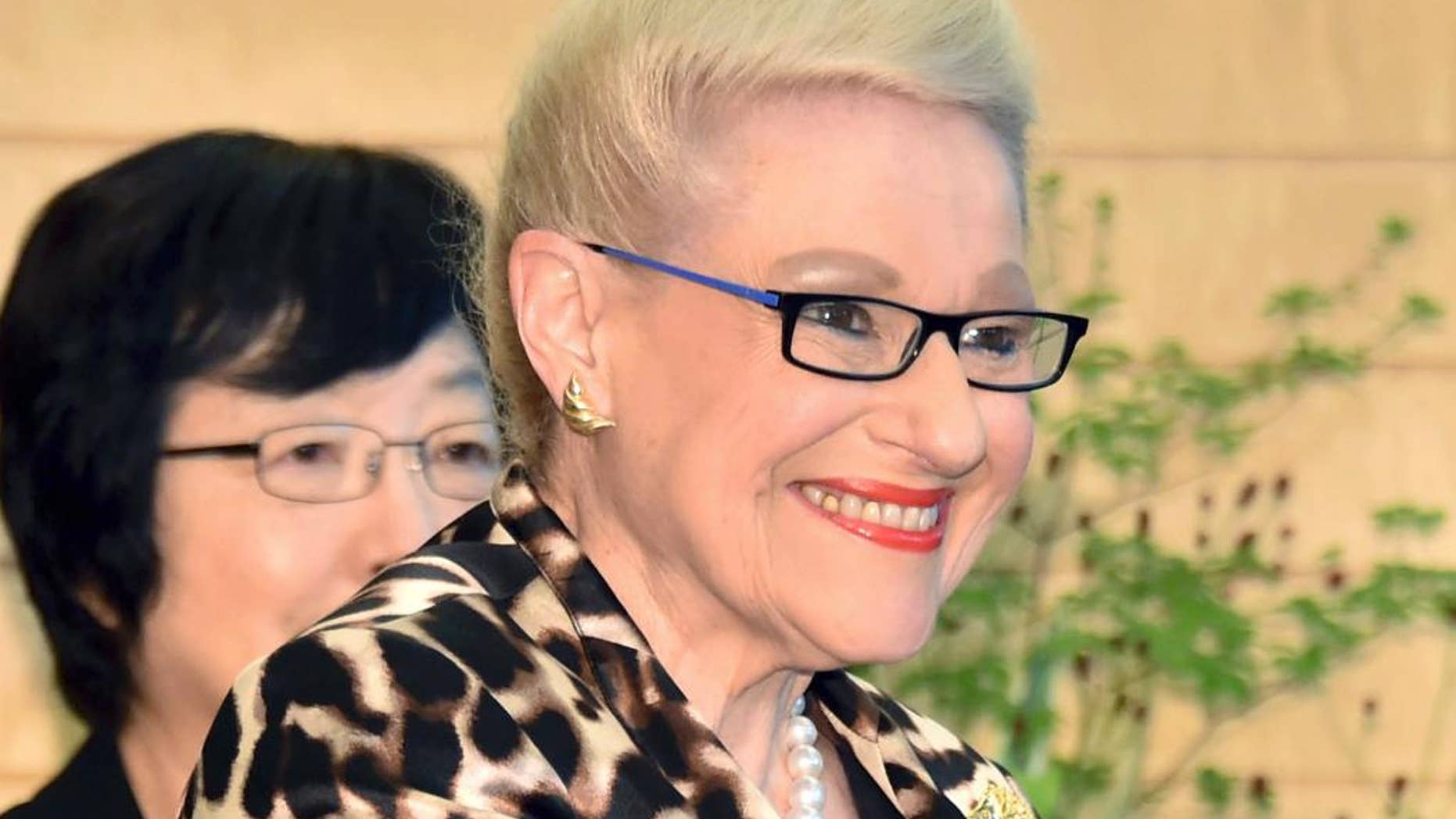 FILE - In this Sept. 10, 2014 file photo, Bronwyn Bishop, speaker of Australia's House of Representatives, shakes hands with Japanese Prime Minister Shinzo Abe as they pose for photos before their talks at Abe's office in Tokyo. Bishop has resigned following weeks of accusations that she used taxpayer money to pay for extravagant and unnecessary travel. Prime Minister Tony Abbott announced Bishop's resignation on Sunday, Aug. 2, 2015. (Yoshikazu Tsuno/Pool Photo via AP, File)