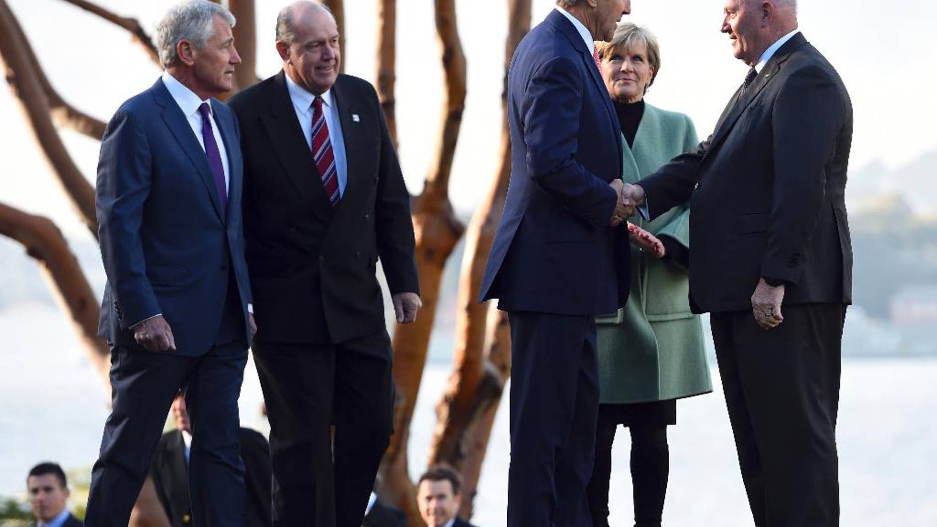 U.S. Secretary of State John Kerry, third from right, along with U.S. Secretary of Defense Chuck Hagel, left, Australian Defense Minister David Johnston, second from left, and Australian Foreign Minister Julie Bishop, is greeted by Governor-General Peter Cosgrove at Admiralty House in Sydney, Tuesday, Aug. 12, 2014. Kerry and Hagel are meeting with their Australian counterparts at the annual Australia-U.S. Ministerial Consultations (AUSMIN), which will focus on regional security and enhanced military co-operation. (AP Photo/Dan Himbrechts, Pool)