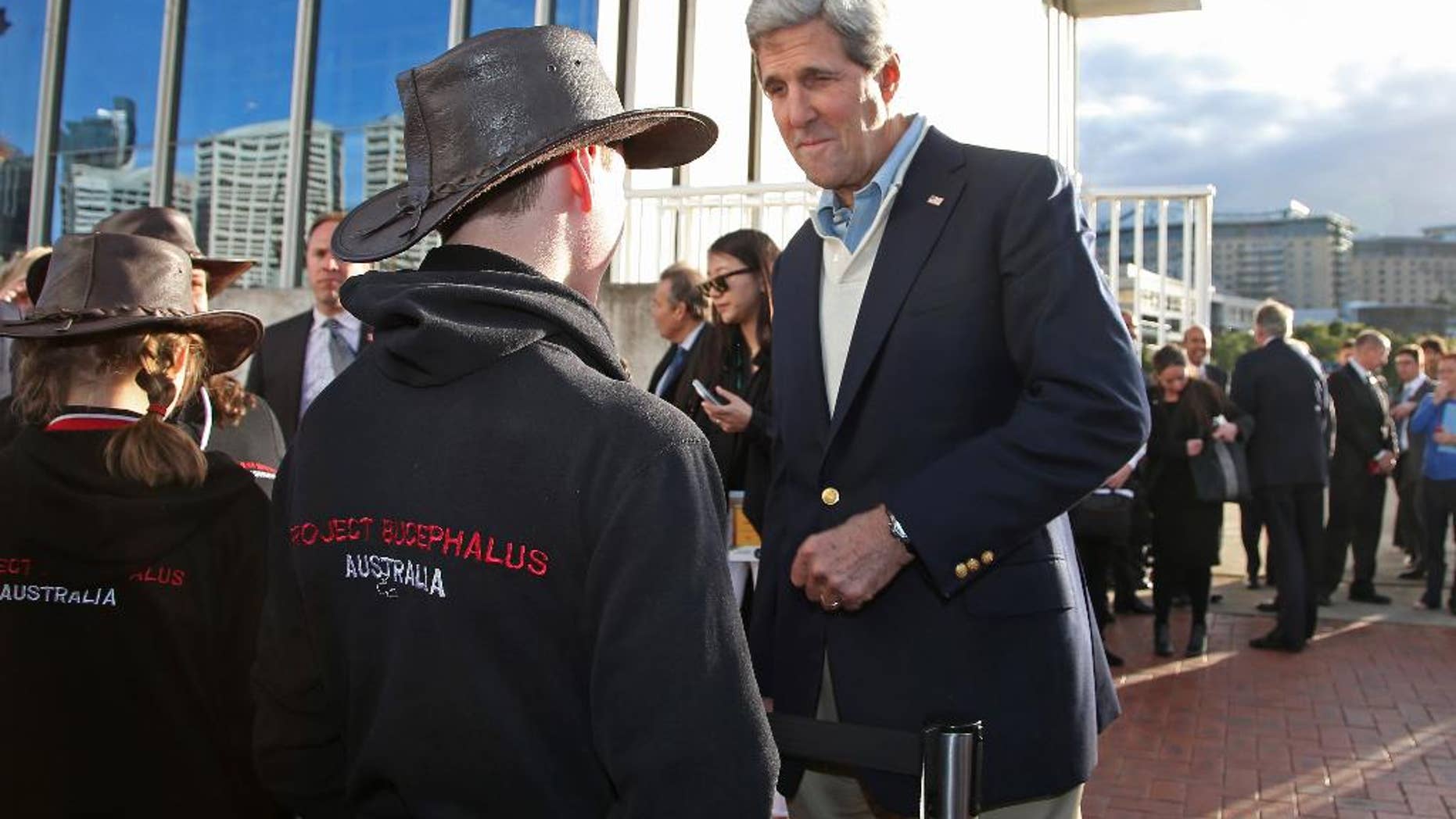 U.S. Secretary of State John Kerry right, chats with school children while visiting the National Maritime Museum in Sydney, Monday, Aug. 11, 2014. Kerry and US Secretary of Defense Chuck Hagel are in Sydney for the annual Australia-United States Ministerial (AUSMIN) talks. (AP Photo/Rick Rycroft)