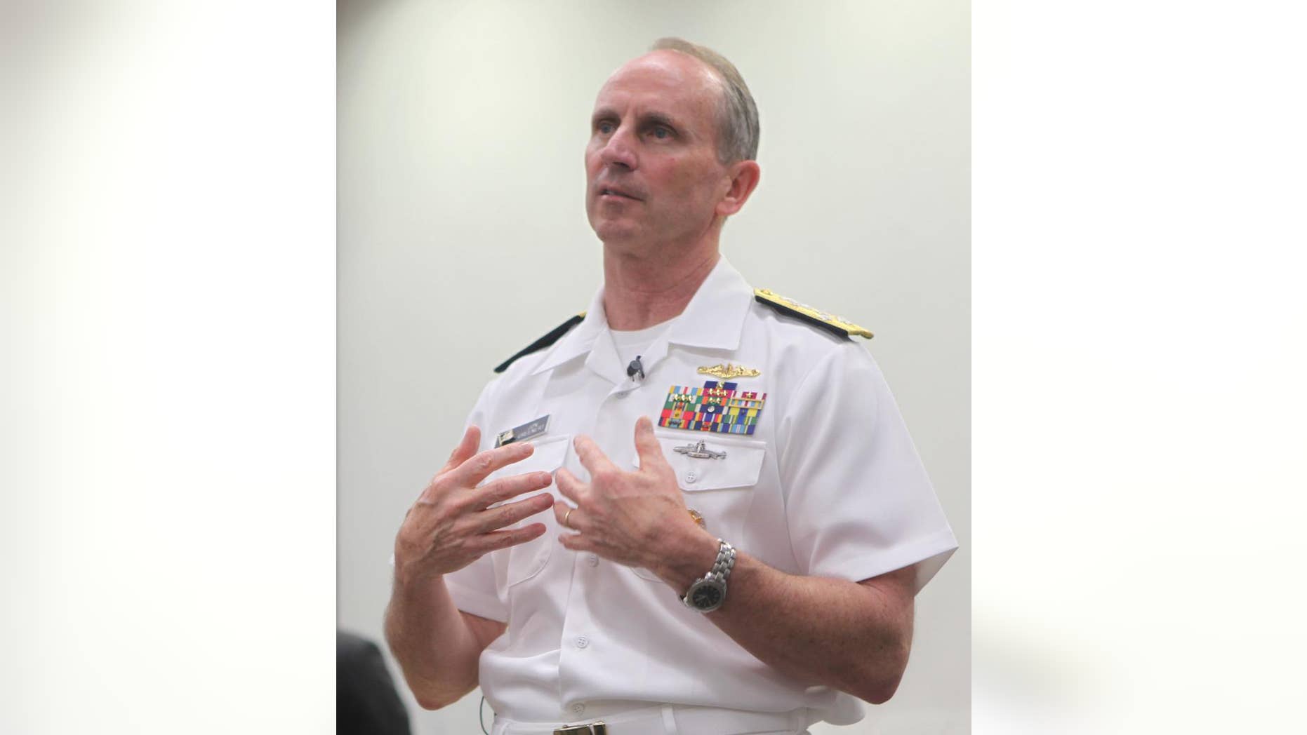 In this photo released by the Australian National University, U.S. Navy Adm. Jonathan Greenert speaks during a lecture at the ANU in Canberra, Australia Tuesday, Feb. 10, 2015. Greenert, who as chief of Naval Operations sets the navy's future strategy, said Tuesday lasers that shoot down drones with precision and electromagnetic cannons that fire more than 100 miles are part of the future of naval warfare, promising to be cheaper to use than conventional weapons. (AP Photo/The Australian National University, Kate Hulm)