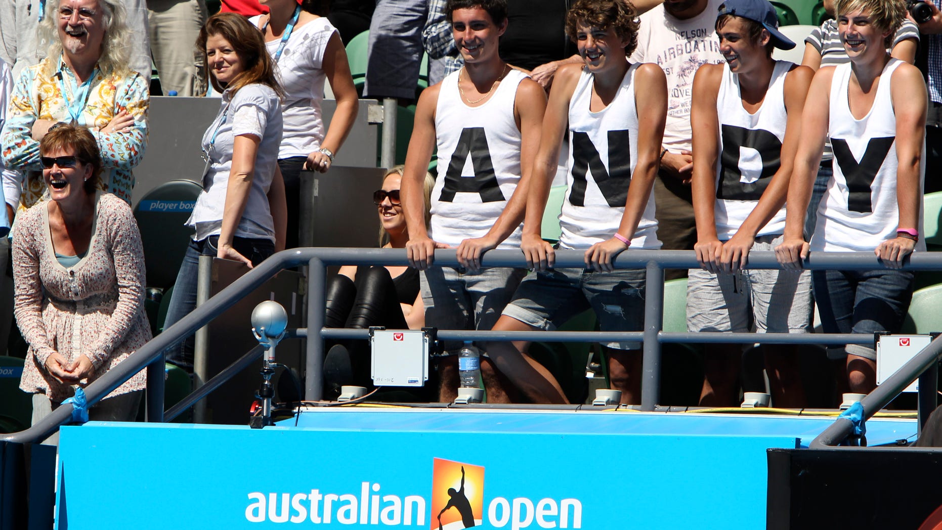 Jan. 24: Scottish comedian Billy Connolly, top left, and Judy Murray, bottom left, stand with supporters of Britain's Andy Murray as he is interviewed after beating Austria's Jurgen Melzer in the fourth round match at the Australian Open tennis championships in Melbourne, Australia.