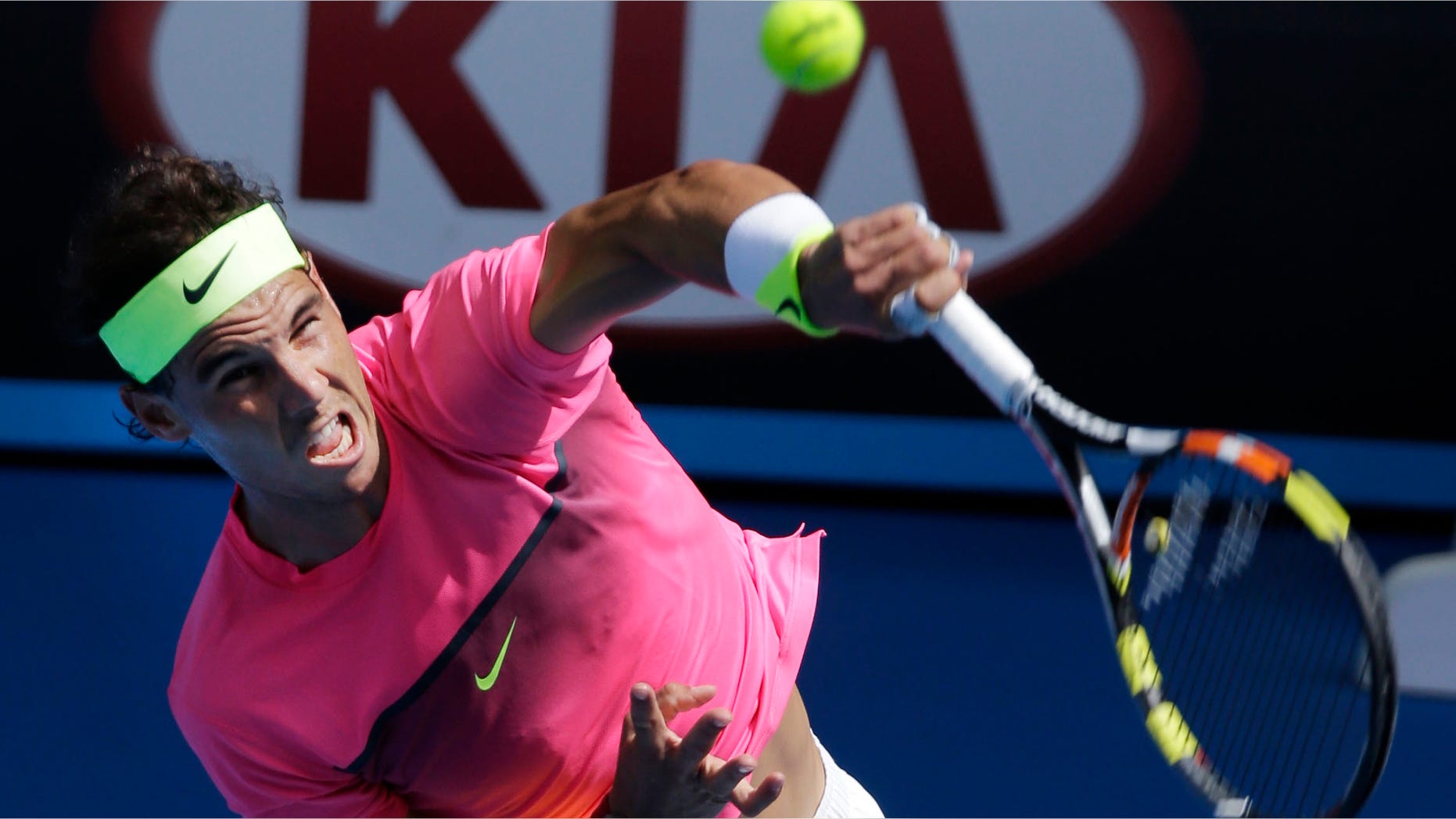 Rafael Nadal of Spain serves to Mikhail Youzhny of Russia during their first round match at the Australian Open tennis championship in Melbourne, Australia, Monday, Jan. 19, 2015. (AP Photo/Bernat Armangue)