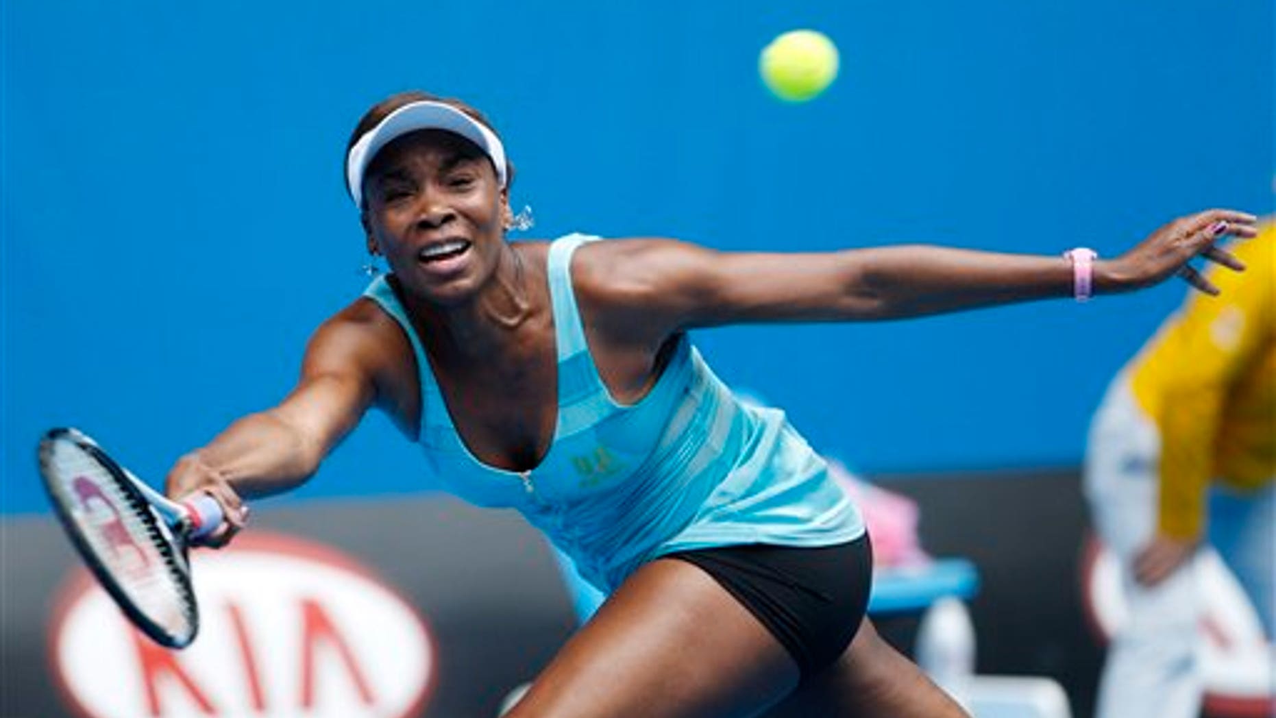 Venus Williams of the U.S. makes a forehand return to Italy's Sara Errani during their first round match at the Australian Open tennis championships in Melbourne, Australia, Monday, Jan. 17, 2011. (AP Photo/Rob Griffith)
