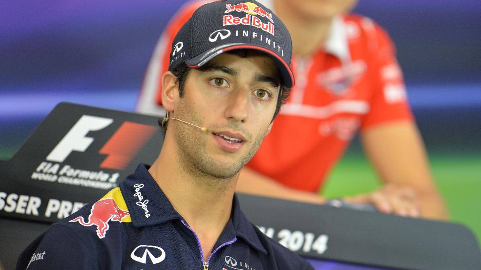 Red Bull driver Daniel Ricciardo of Australia listens to a question from a journalist during a press conference in Spielberg, Austrian province of Styria, Thursday, June 19, 2014. The Austria Formula One Grand Prix will be held here on Sunday. (AP Photo/Kerstin Joensson)