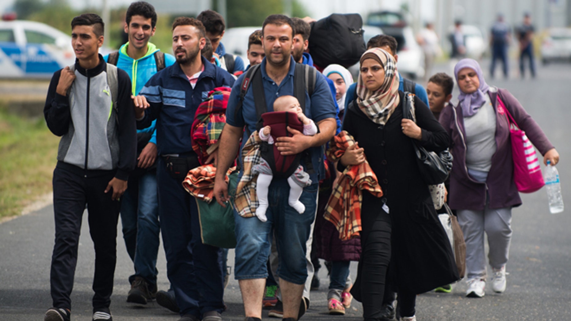 Sept. 14, 2015: Refugees arrive at the border between Austria and Hungary near Heiligenkreuz.