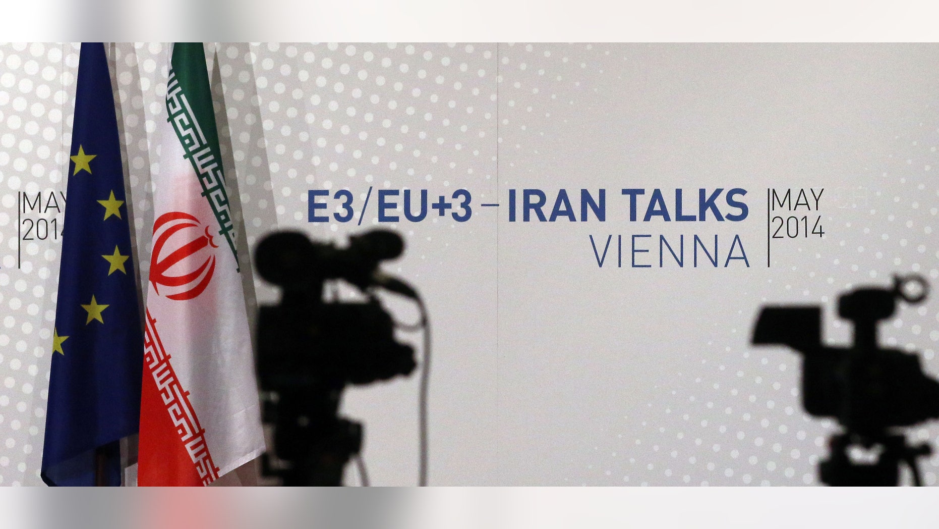 May 16, 2014 - Video cameras stand in front of flags of the EU and Iran and a poster of the Iran talks where closed-door nuclear talks take place at the International Center in Vienna, Austria. Talks between Iran and 6 world powers have entered an ambitious new stage with 2 sides sitting down to start drafting the text of a final deal.