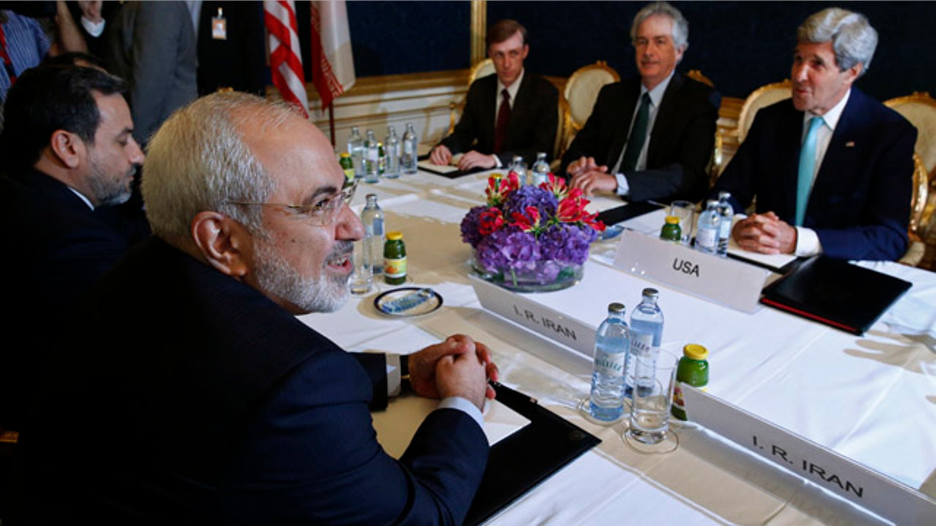 July 13, 2014: Iran's Foreign Minister Mohammad Javad Zarif, left, meets with U.S. Secretary of State John Kerry, right, at talks between the foreign ministers of the six powers negotiating with Tehran on its nuclear program in Vienna. (AP Photo/Jim Bourg, Pool)