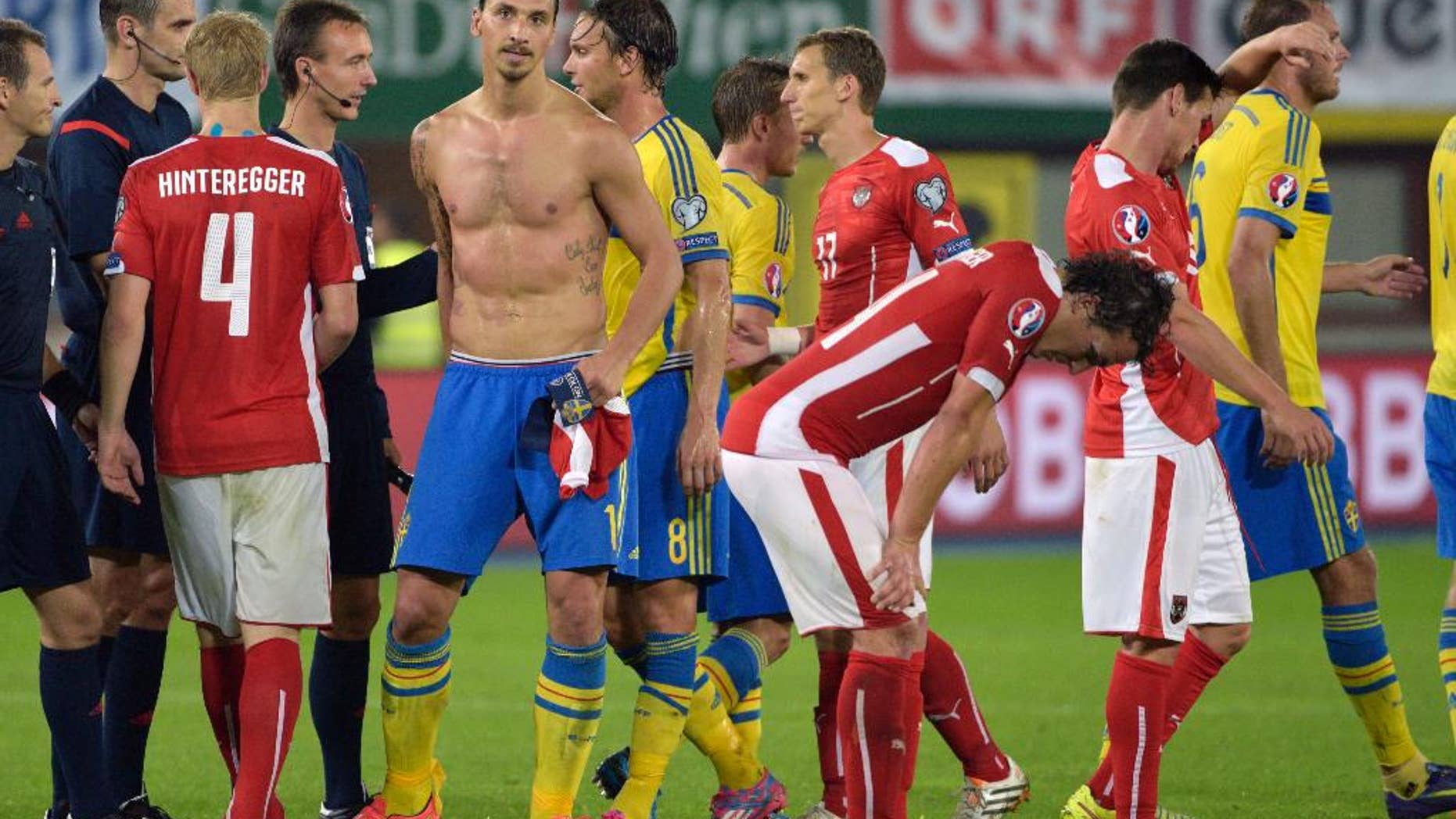 Austria's Martin Hinteregger, Sweden's Zlatan Ibrahimovic, Albin Ekdal, Pierre Bengtsson, Austria's Florian Klein, Julian Baumgartlinger, Christoph Leitgeb and Andreas Granqvist, from left, after the Euro 2016 soccer qualifying group G match between Austria and Sweden in Vienna, Austria, Monday, Sept. 8, 2014. (AP Photo/Hans Punz)