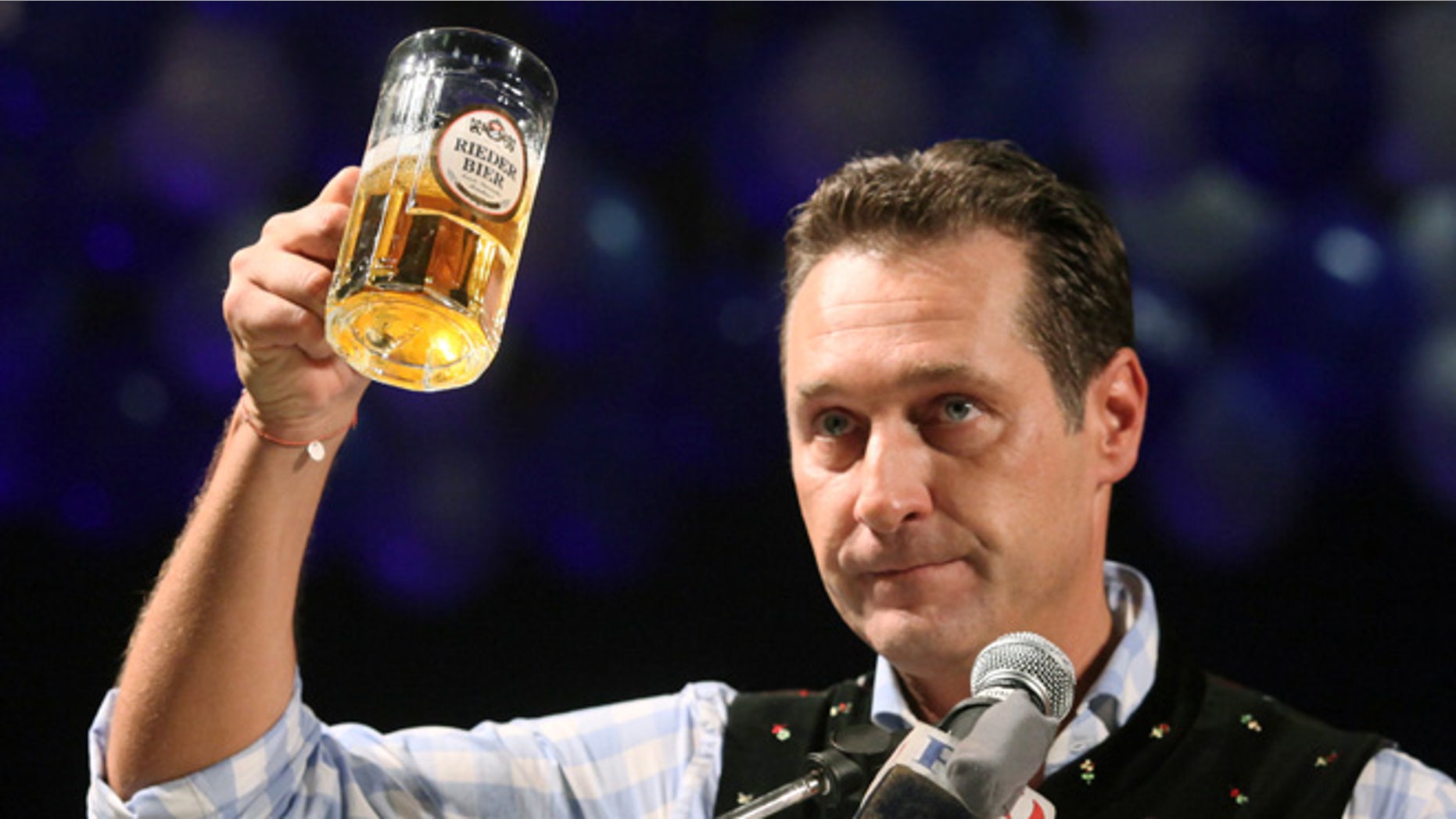 Feb. 22, 2012: In this file photo head of the Austrian right-wing Freedom Party Heinz-Christian Strache lifts a glass of beer during his traditional Ash Wednesday speech in Ried, Austria.
