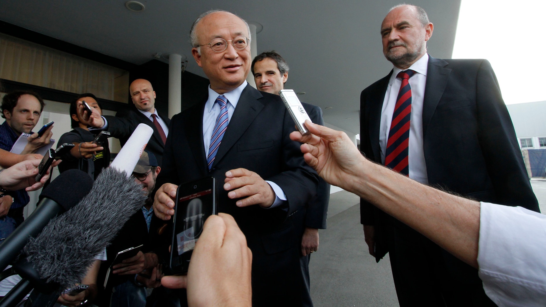 May 20, 2012: Director General of the International Atomic Energy Agency, IAEA, Yukiya Amano from Japan and Herman Nackaerts, from left, of the IAEA the chief agency official in charge of the Iran file speak to the media before his flight to Iran at the Vienna International Airport near Schwechat, Austria.