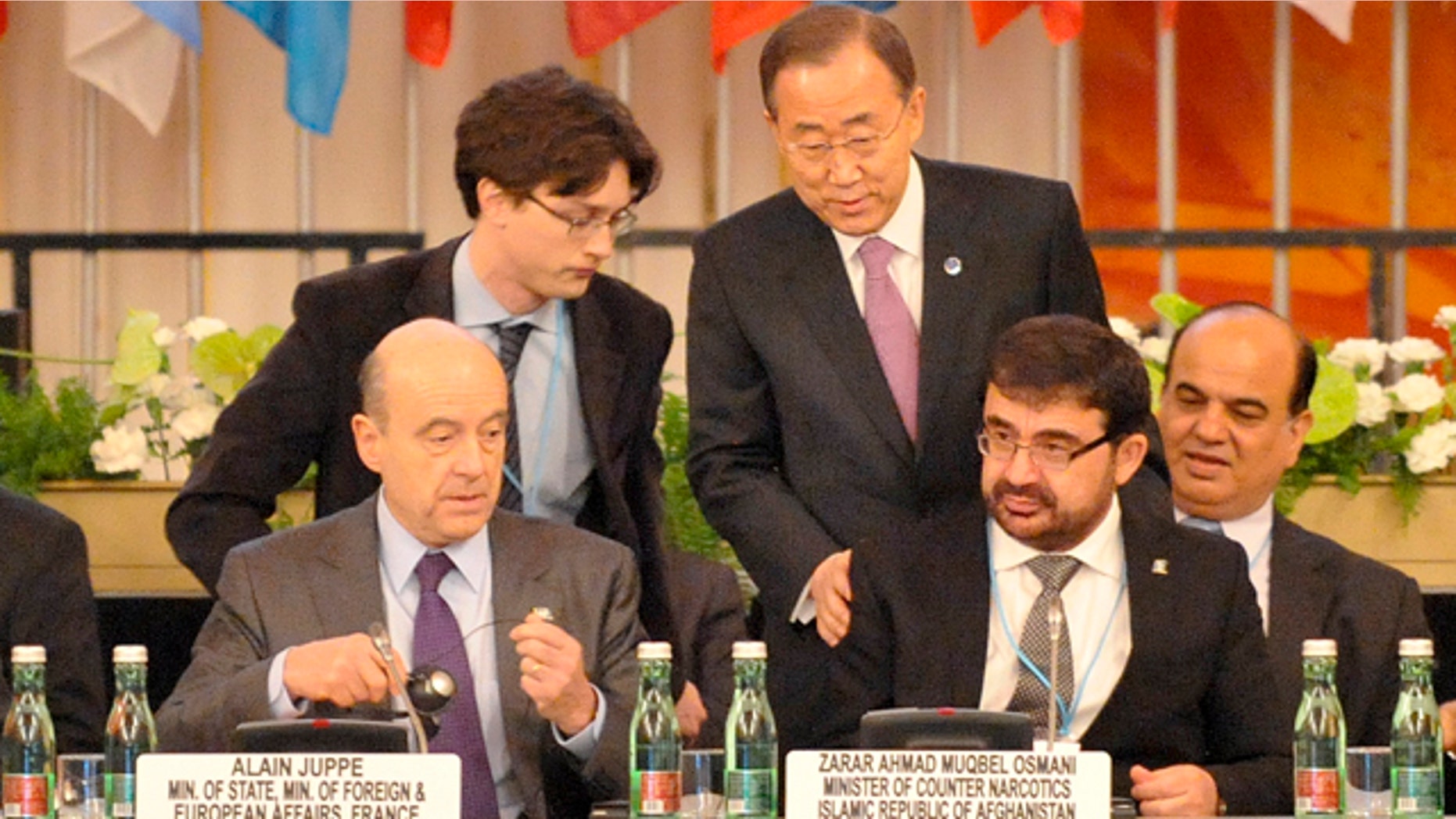 Thursday, Feb. 16, 2012- UN Secretary General Ban Ki-moon, center right, welcomes the Afghan Minister of Counter Narcotics Zarar Ahmed Muqbel Osmani, right, and French Foreign Minister Alain Juppe, left, at the third Ministerial Conference of the Paris Pact Partners in Vienna, Austria.