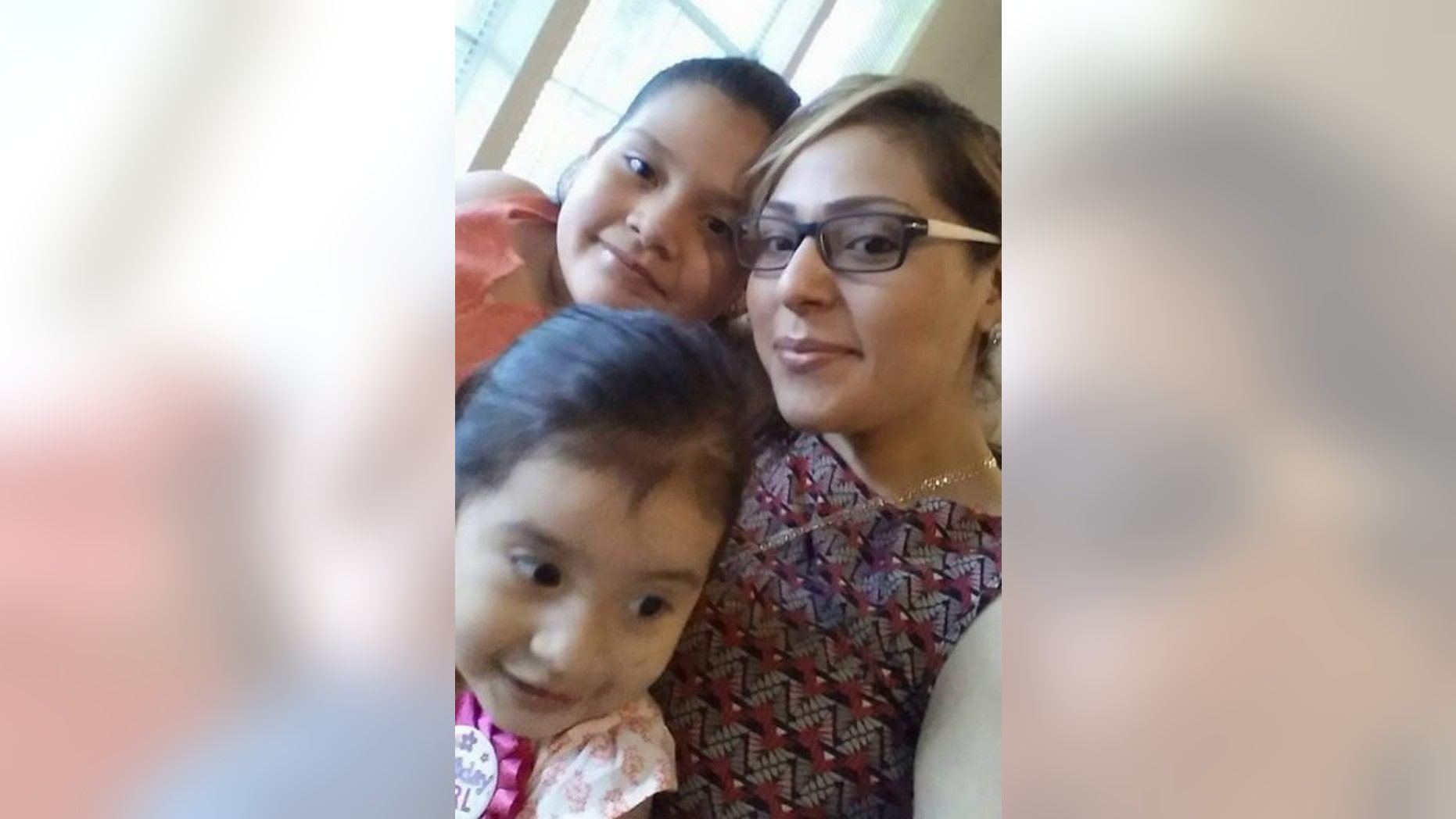 Diana Gomez with daughters Betsy and little Ava, in the front.