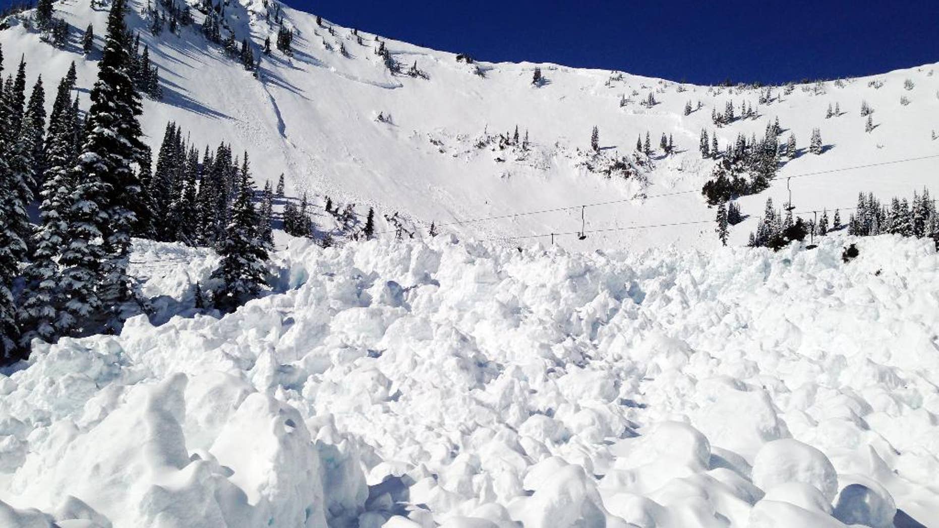 In this photo provided by Crystal Mountain Resort, snow from a 30-foot deep avalanche that wiped out a chairlift a day earlier remains behind Tuesday, March 11, 2014, at Crystal Mountain, Wash. The avalanche that was intentionally triggered by the Ski Patrol brought down more snow than expected and wiped out a chairlift at the resort near Mount Rainier. No one was injured. Members of the Ski Patrol threw a 40-pound explosive on unstable snow as a safety precaution on the slope at 4:45 p.m. Monday after the resort had closed, but snow hit the High Campbell chairlift, the highest of 10 chairlifts at the resort on the northeast corner of Mount Rainier National Park. (AP Photo/Crystal Mountain Resort)