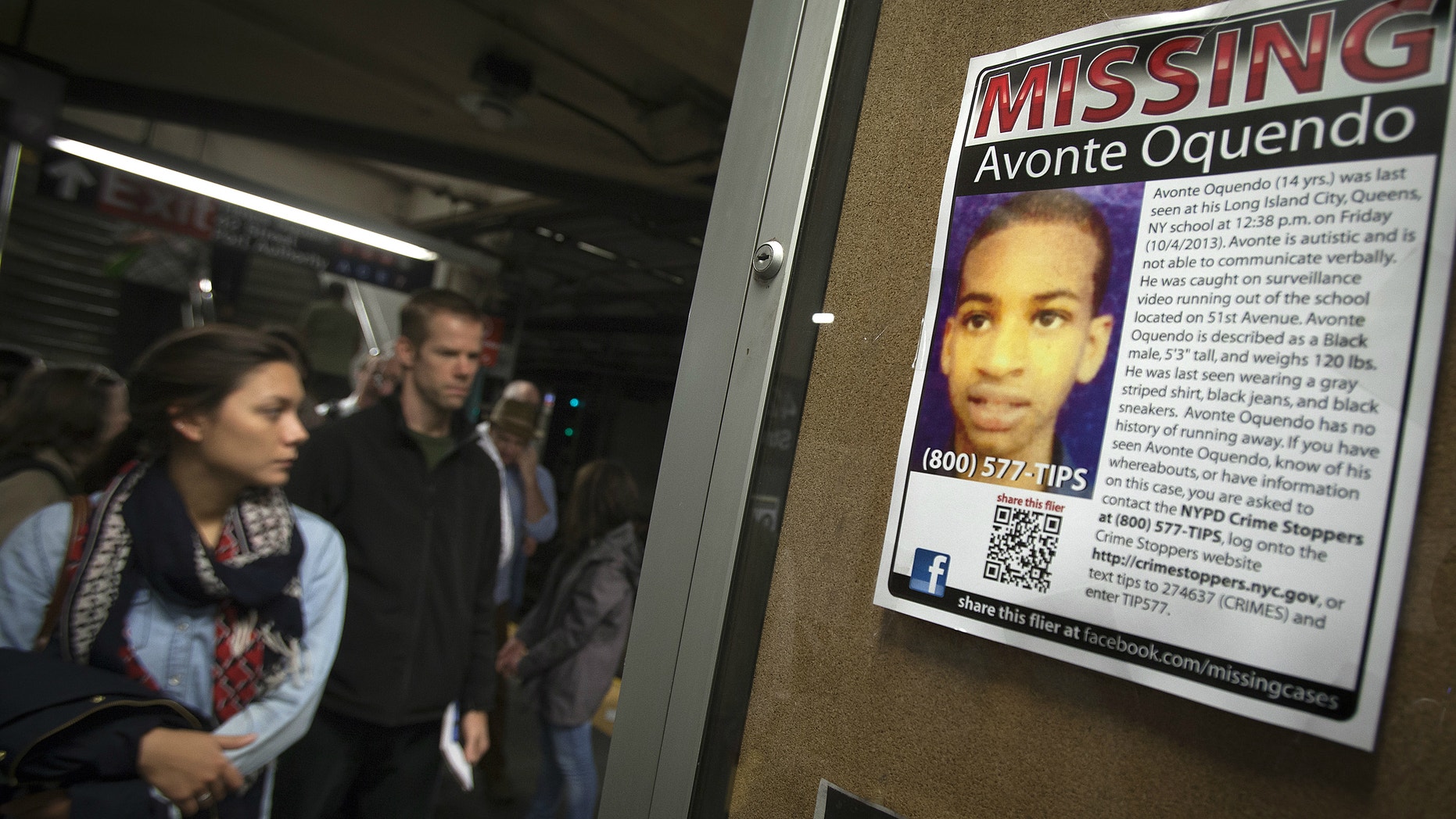 A poster for Avonte Oquendo, the 14-year-old autistic child who went missing from his school in Queens on October 4, 2013, is seen in the Times Square subway stop in New York.