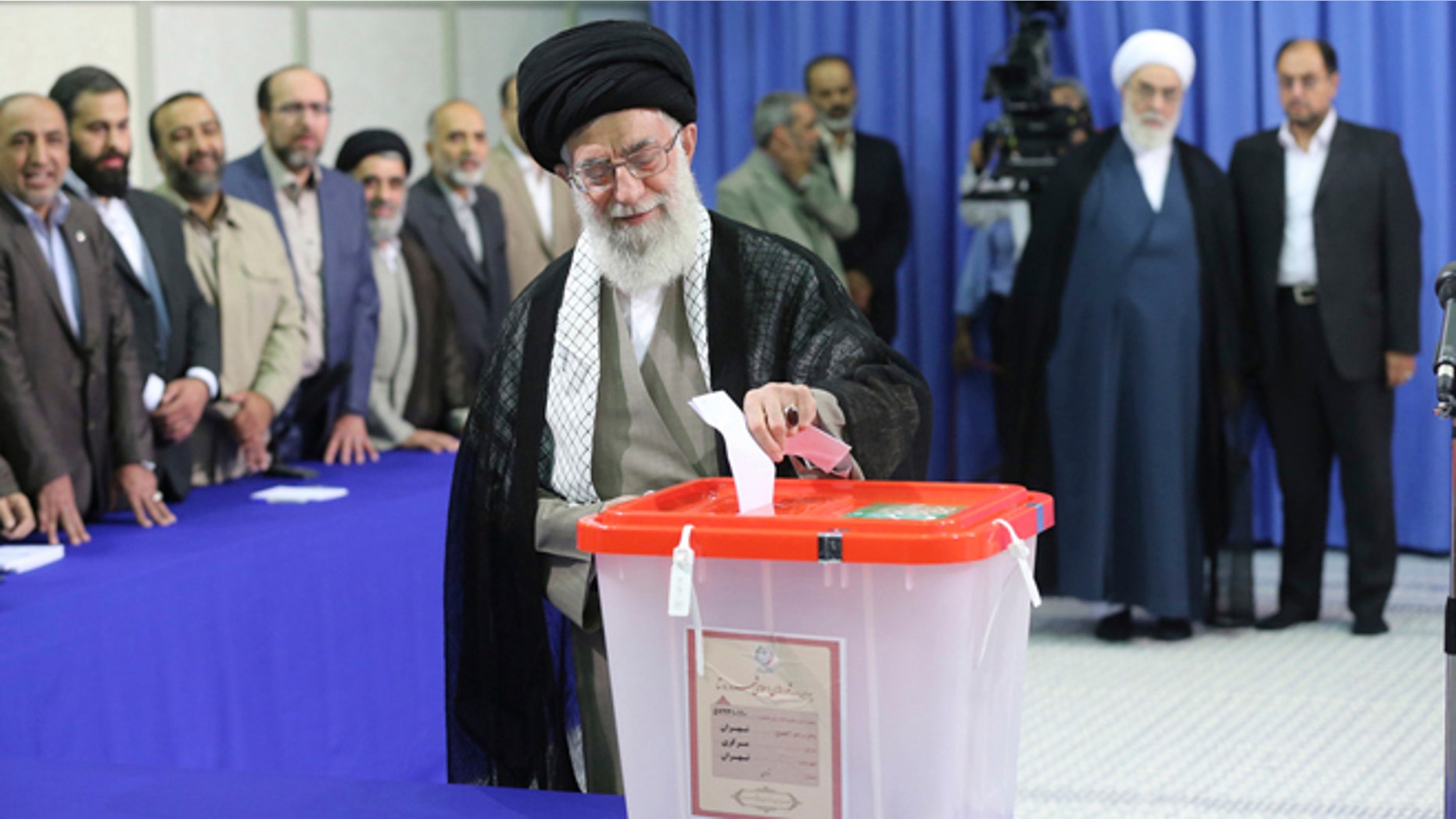 In this June 14, 2013 file photo, Iran's Supreme Leader Ayatollah Ali Khamenei casts his ballot at his office during the Iranian presidential election in central Tehran.