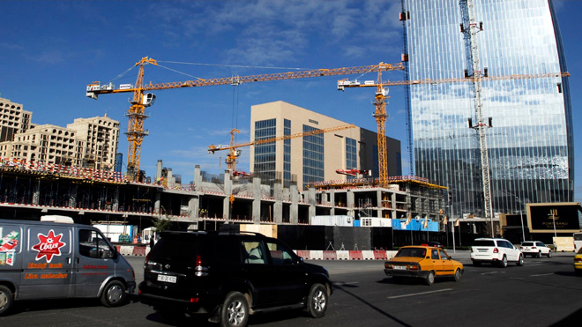 Nov. 3, 2012: Cars drive past buildings which are under construction in Azerbaijan's capital Baku.