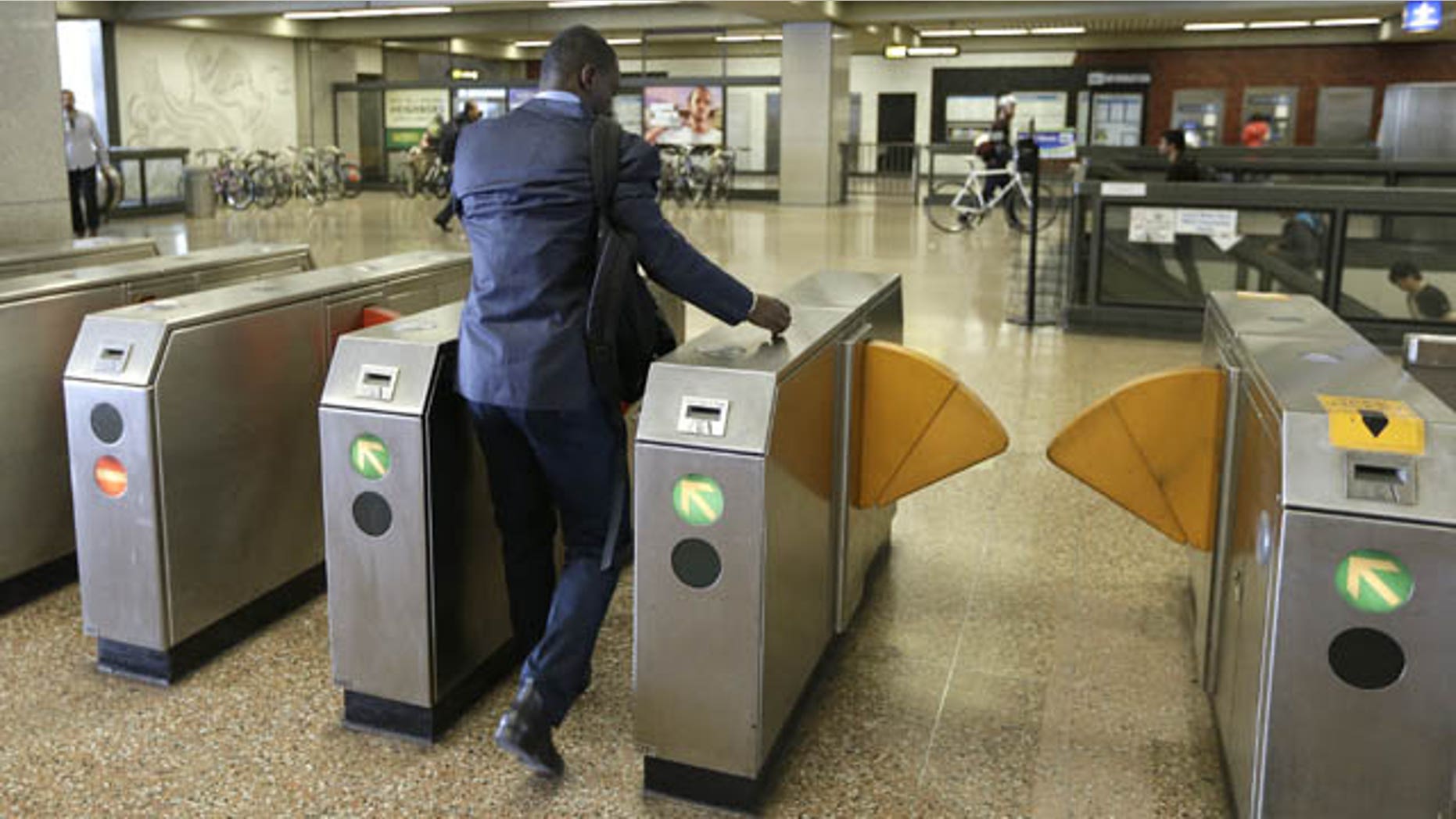 October 14, 2013: A man enters the Lake Merritt BART station Monday in Oakland, Calif. (AP Photo)