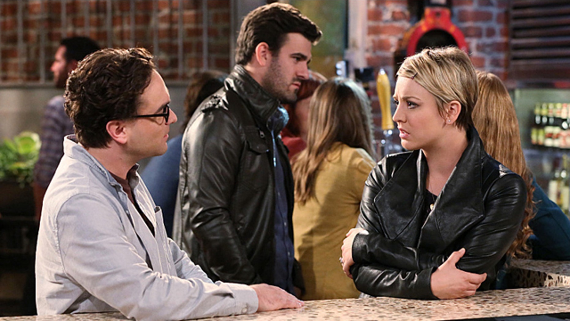 Leonard (Johnny Galecki) and Penny (Kaley Cuoco-Sweeting) try to prove Sheldon wrong after he says that he and Amy are a 'superior couple' on 'The Big Bang Theory' (Michael Yarish/Warner Bros. Entertainment Inc.)