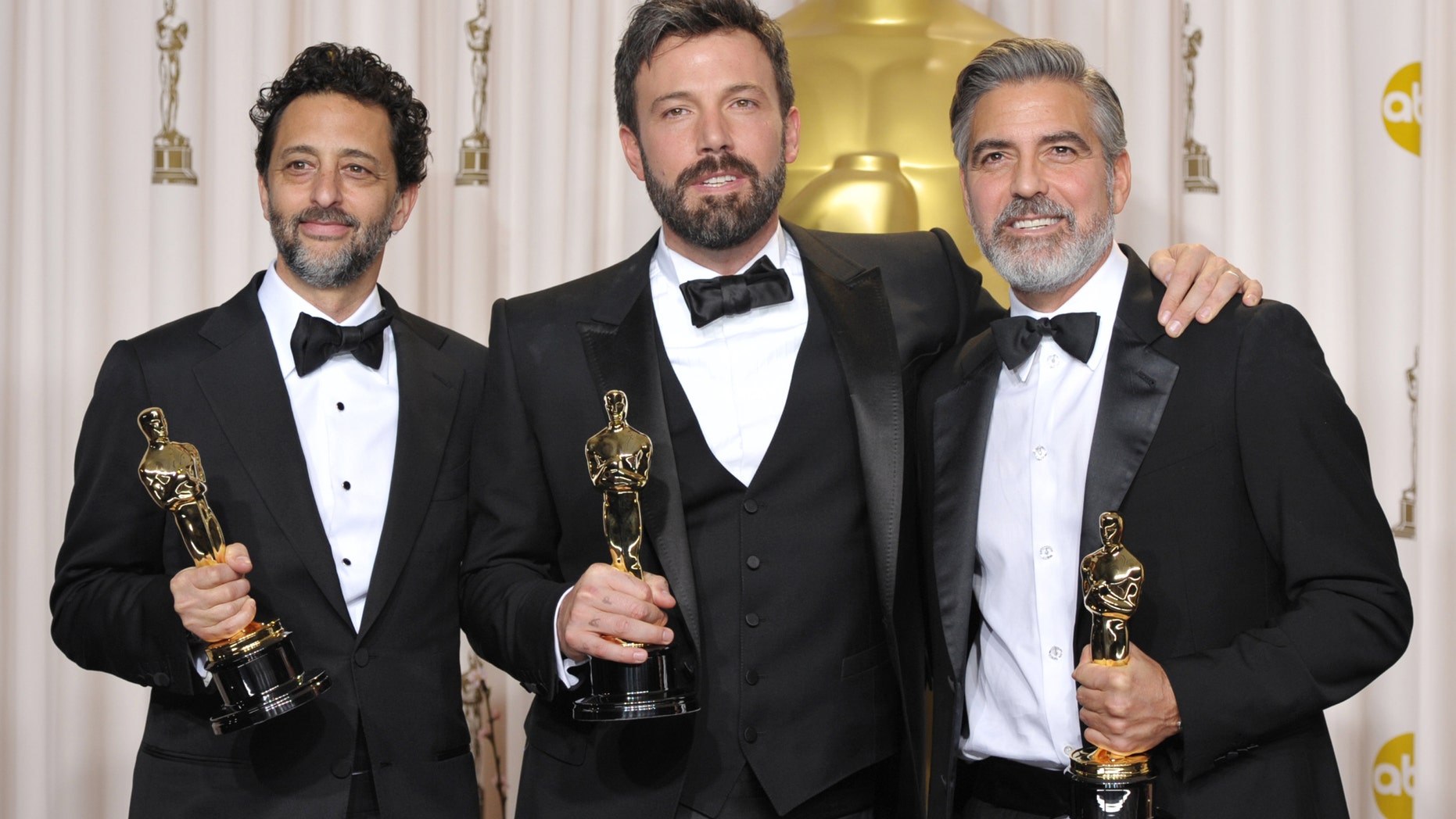 Grant Heslov, from left, Ben Affleck, and George Clooney pose with their award for best picture for "Argo" during the Oscars at the Dolby Theatre on Sunday Feb. 24, 2013, in Los Angeles.