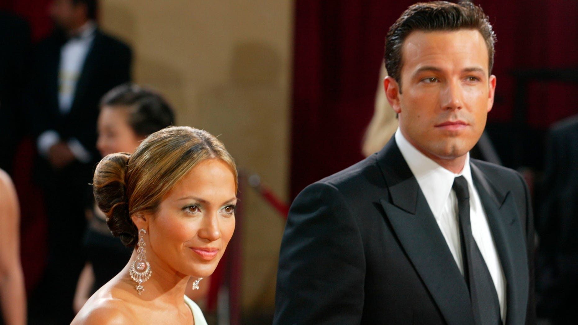 HOLLYWOOD - MARCH 23: (FILE PHOTO) Actors Ben Affleck and fiancee Jennifer Lopez attend the 75th Annual Academy Awards at the Kodak Theater on March 23, 2003 in Hollywood, California. Police in North Carolina have issued a warrant for the arrest of Ben Affleck after a woman claimed that he threatened to kill her. In a sworn statement in front of a magistrate the woman, Tara Ray, testified that Affleck had followed her home and communicated threats to her. Aflleck's spokesman called the allegation as absurd and defamatory. (Photo by Kevin Winter/Getty Images)
