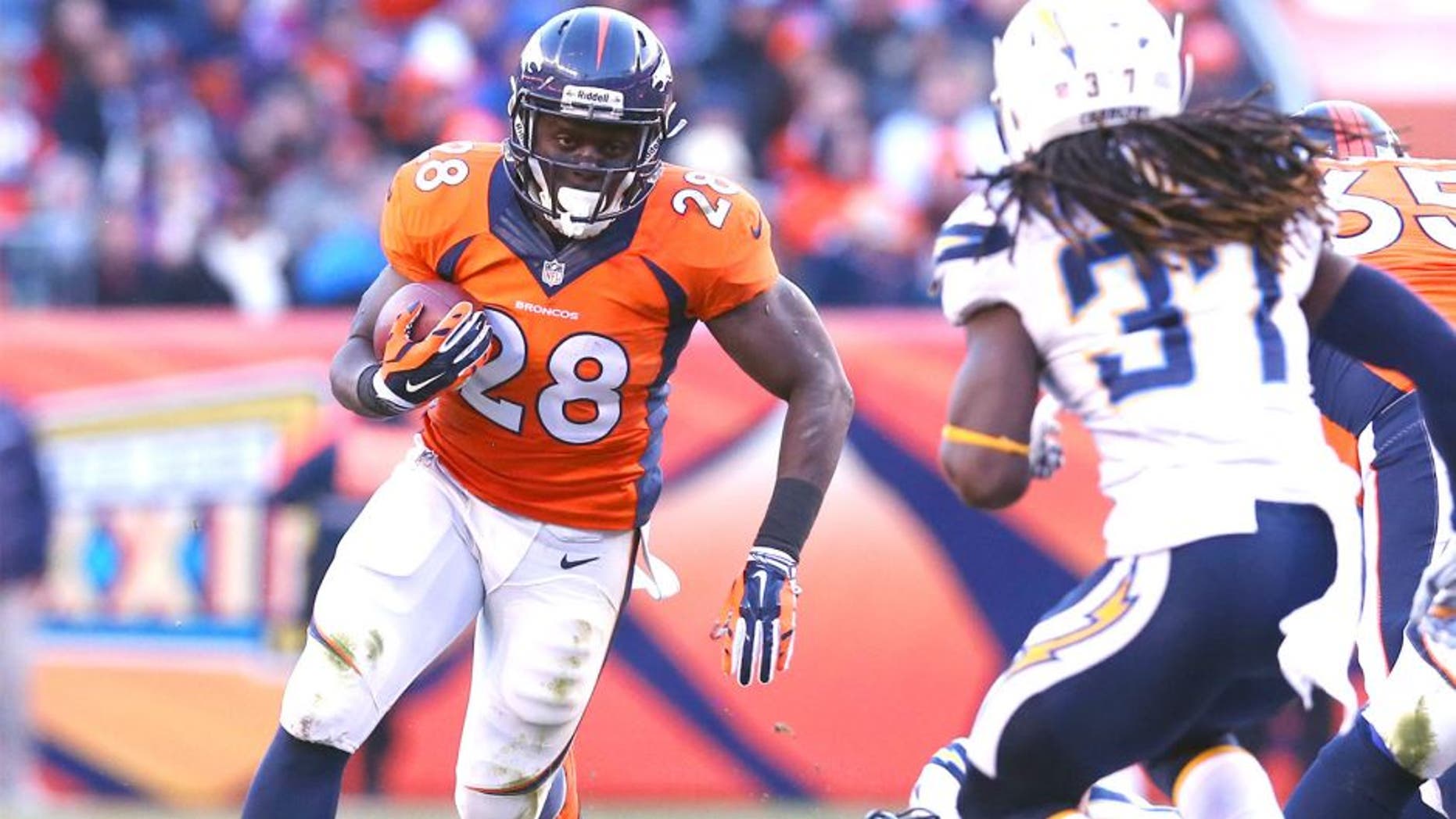 Jan 12, 2014; Denver, CO, USA; Denver Broncos running back Montee Ball (28) runs with the ball against San Diego Chargers safety Jahleel Addae (37) during the 2013 AFC divisional playoff football game at Sports Authority Field at Mile High. Mandatory Credit: Matthew Emmons-USA TODAY Sports