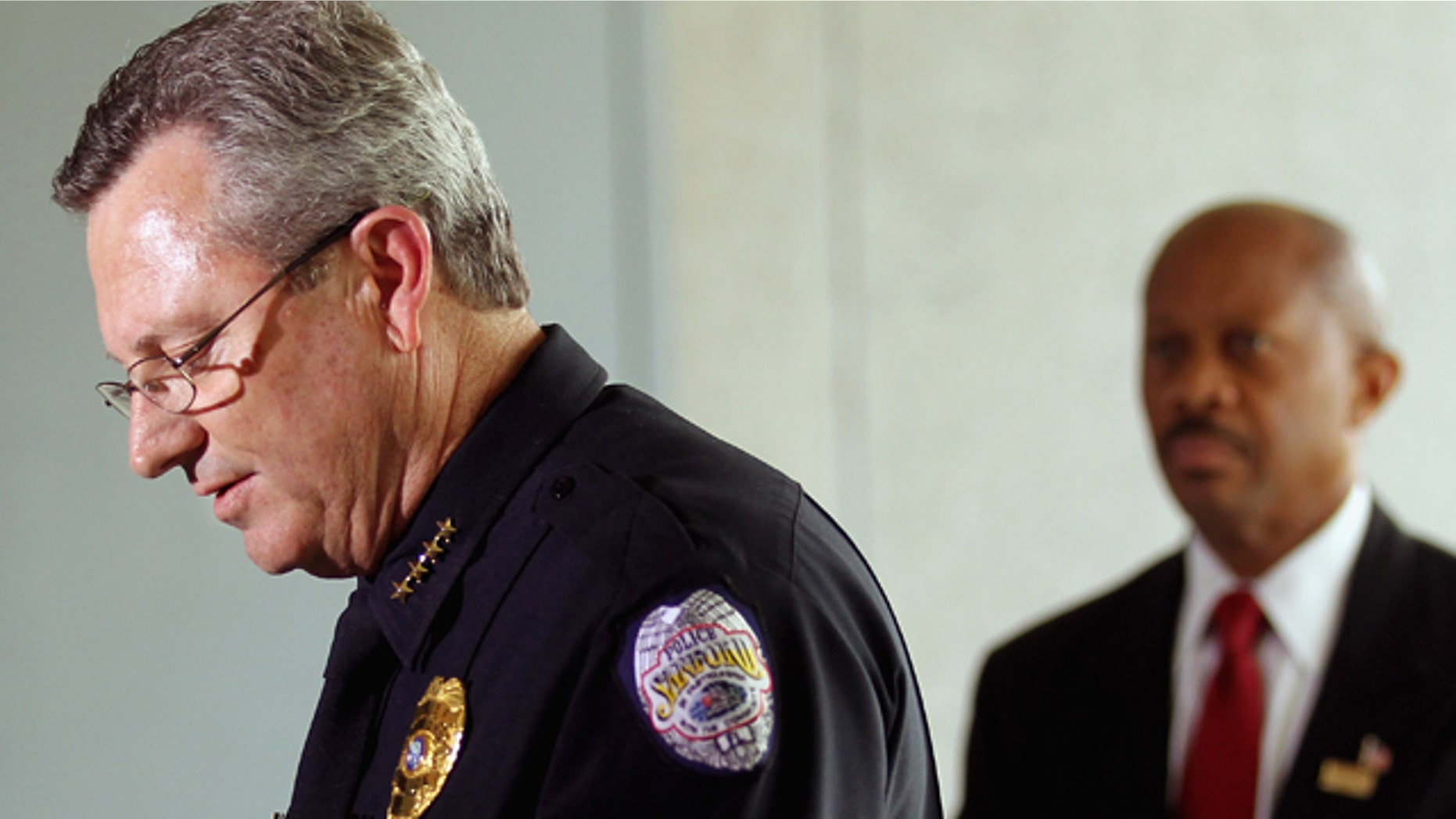 March 22, 2012: Sanford Police Department Chief Bill Lee (L) speaks while announcing he will temporarily step down in the wake of the Trayvon Martin killing as Sanford city manager Norton Bonaparte Jr. (R) stands by in Sanford, Florida.