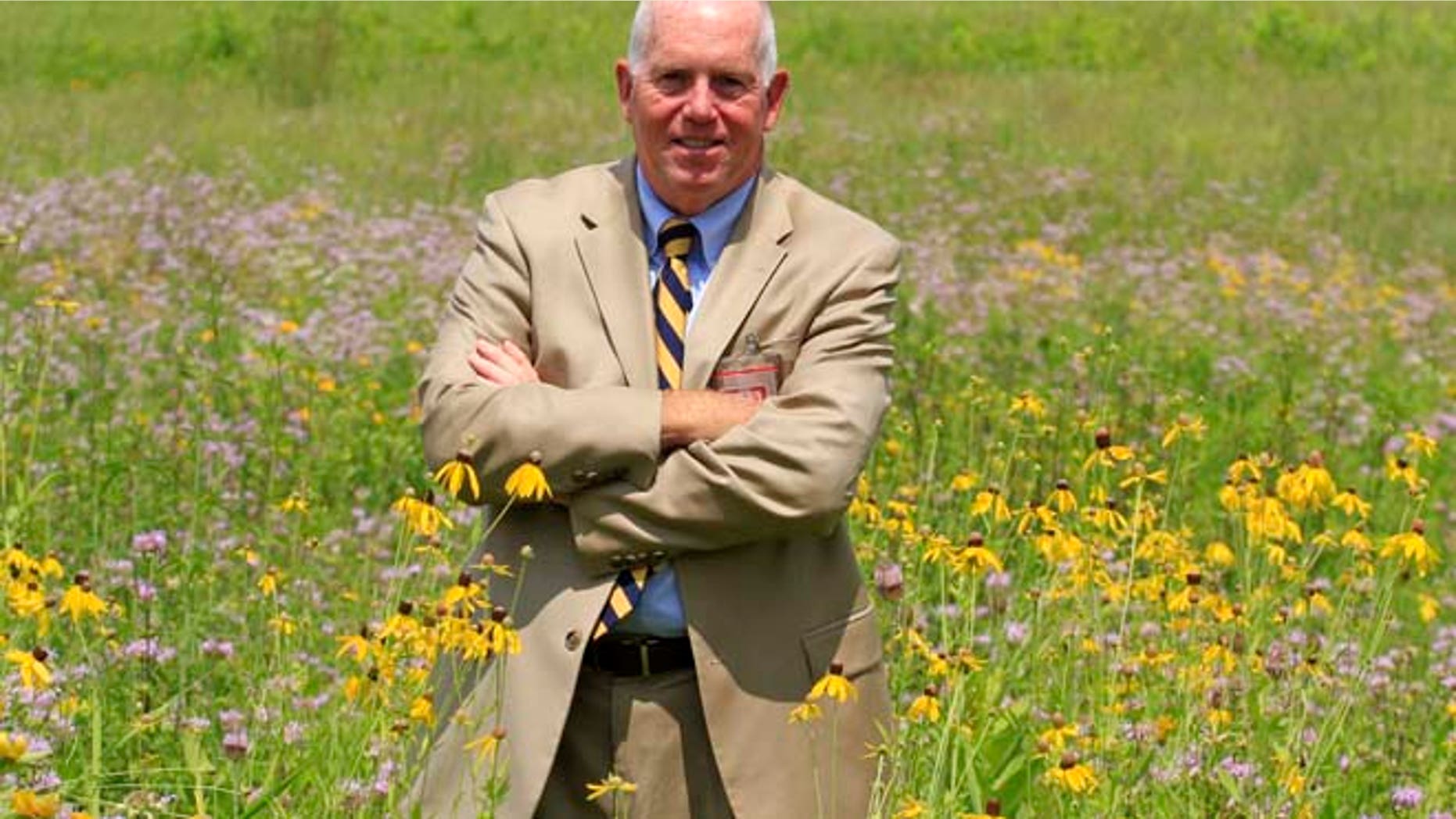 July 17, 2014: Terrence Slaybaugh, director of aviation for Dayton International Airport, poses in one of the airport's prairies in Vandalia, Ohio.