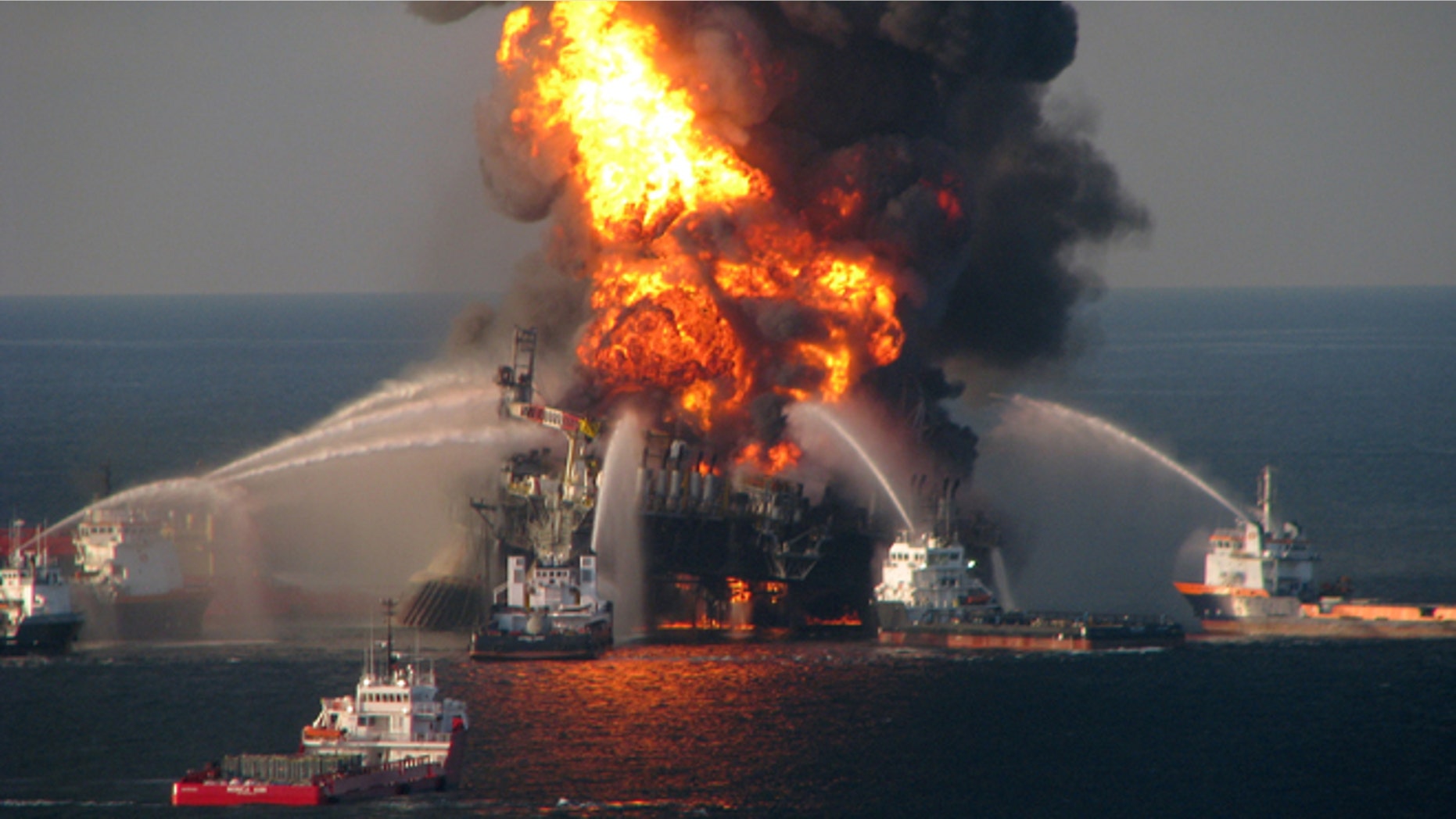 GULF OF MEXICO - APRIL 21: In this handout image provided be the U.S. Coast Guard, fire boat response crews battle the blazing remnants of the off shore oil rig Deepwater Horizon in the Gulf of Mexico on April 21, 2010 near New Orleans, Louisiana. An estimated leak of 1,000 barrels of oil a day are still leaking into the gulf. Multiple Coast Guard helicopters, planes and cutters responded to rescue the Deepwater Horizon's 126 person crew. (Photo by U.S. Coast Guard via Getty Images)