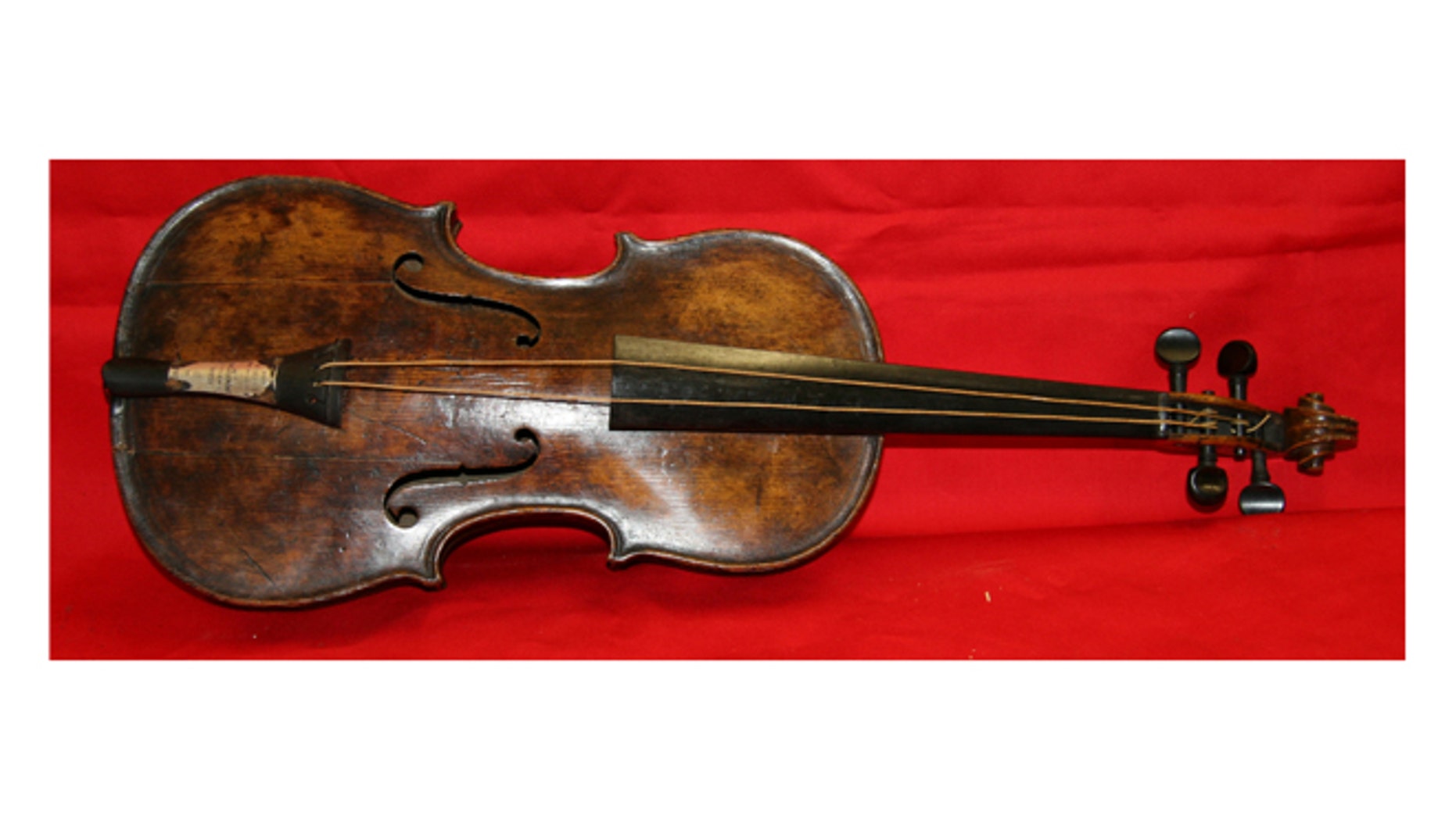 In this undated photo provided by Henry Aldridge shows the violin that was played by the bandmaster of the Titanic as the oceanliner sank, Devizes, England.